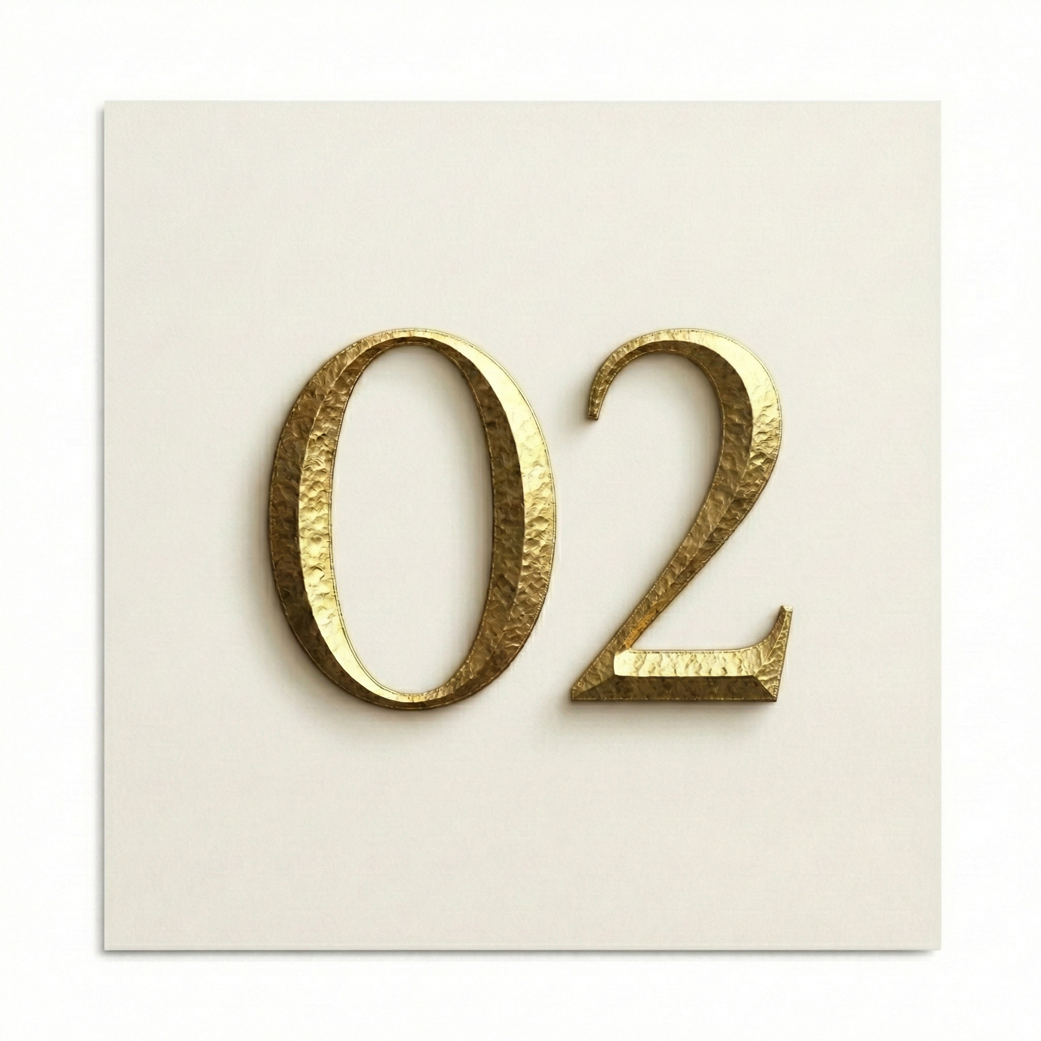 Champagne gold number 02 on ivory background representing design phase in bespoke travel planning process