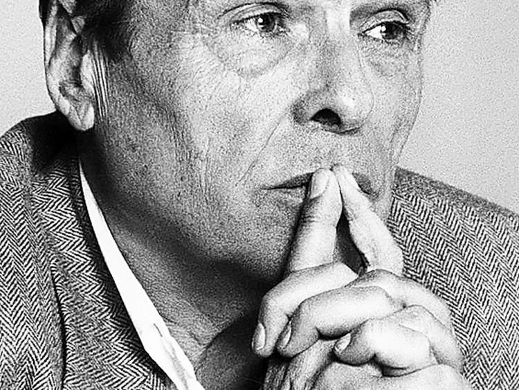 Black and white image of Pierre Bourdieu looking thoughtful.