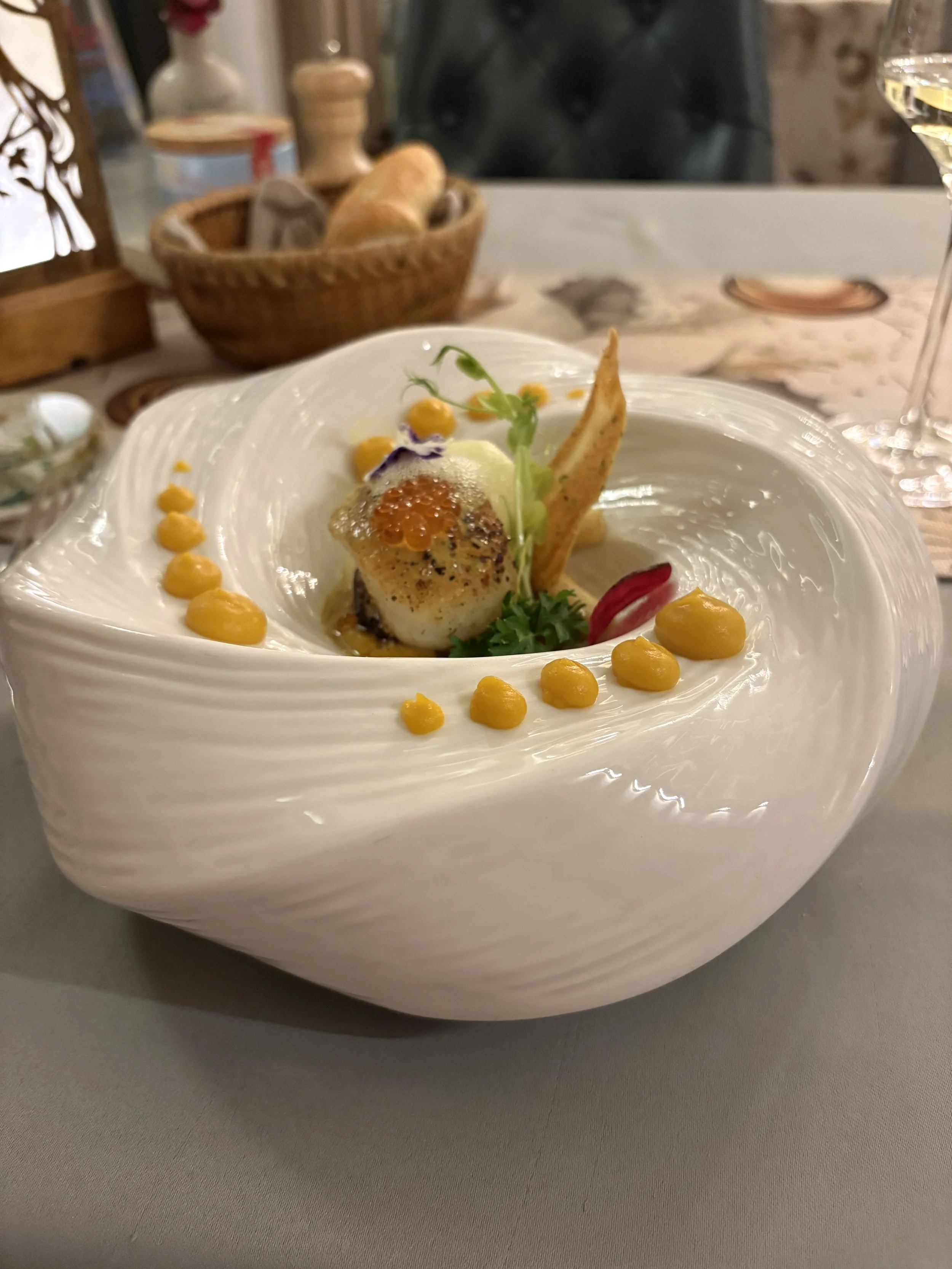 A scallop on pumpkin and apple.