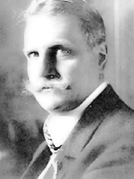 A portrait of a fabulous mustache wearing a man named Robert Michels, German-Italian Sociologist.