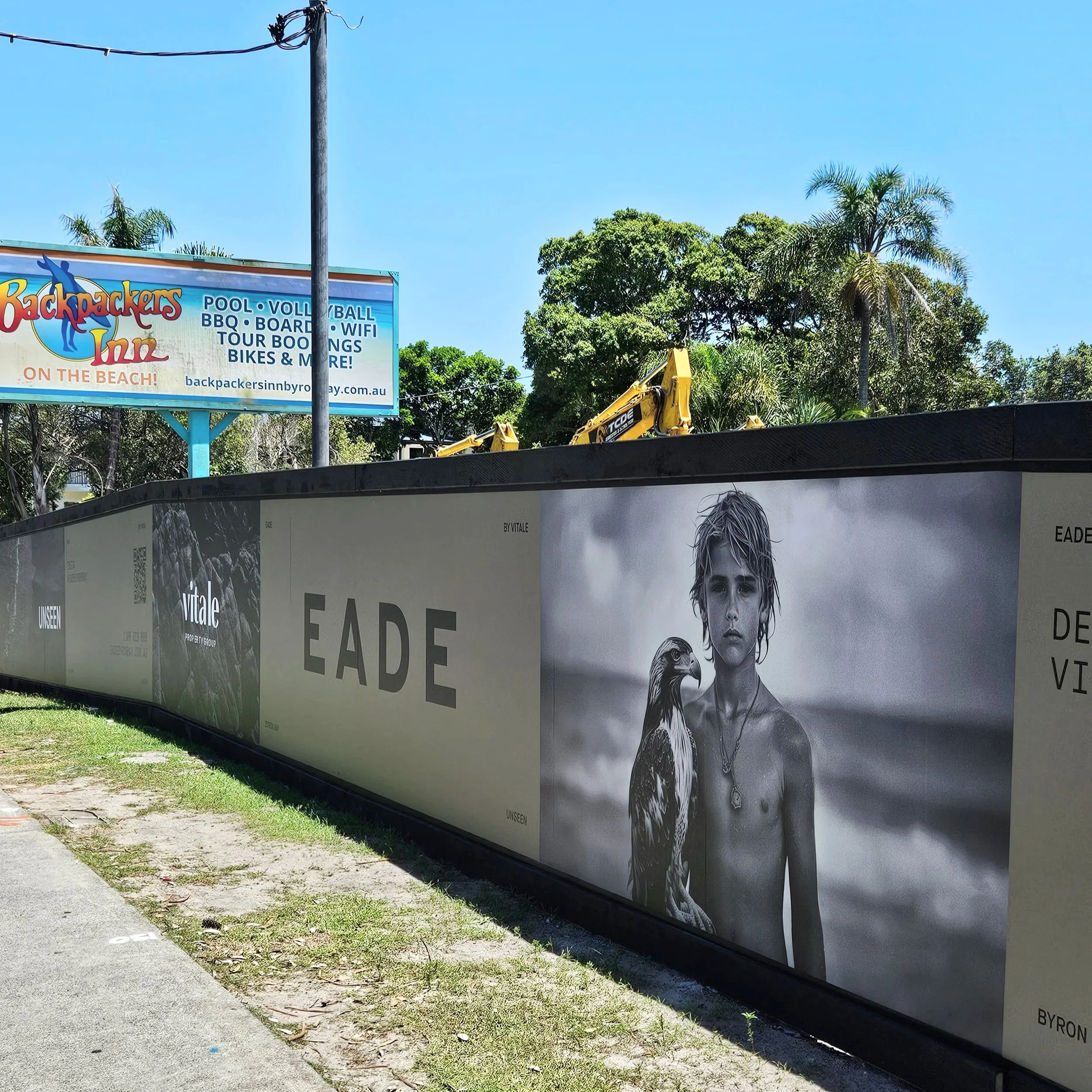 Development site, Byron Bay, hording and promotional images boy with eagle