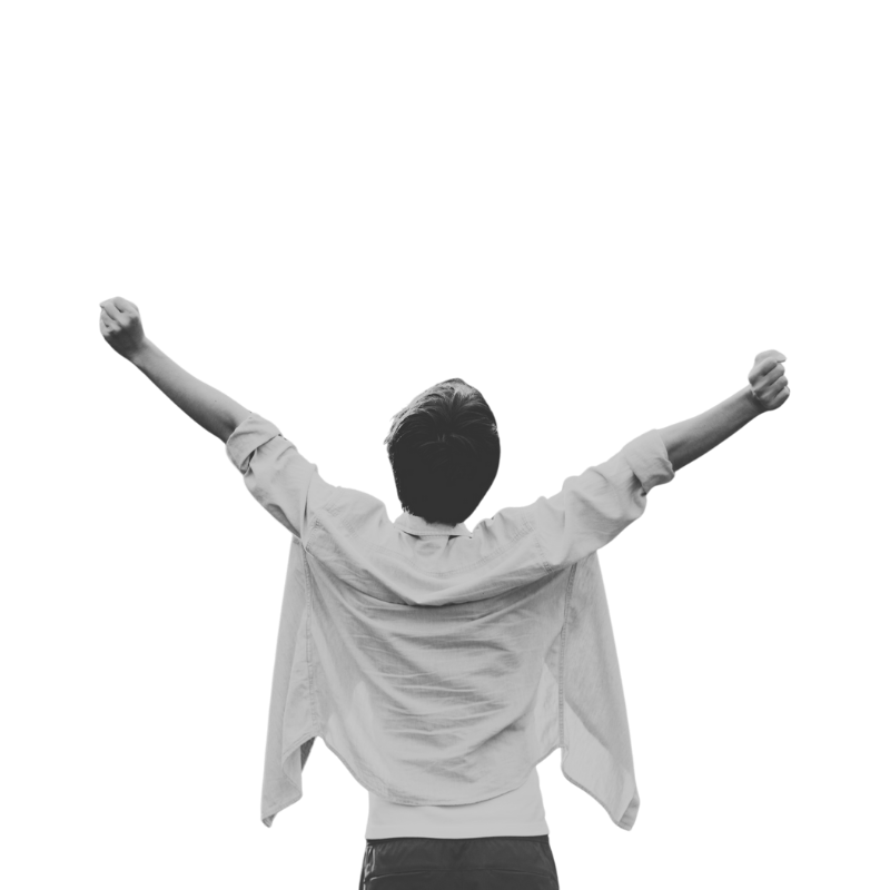 Back view of a young man with raised arms, celebrating or triumphant.