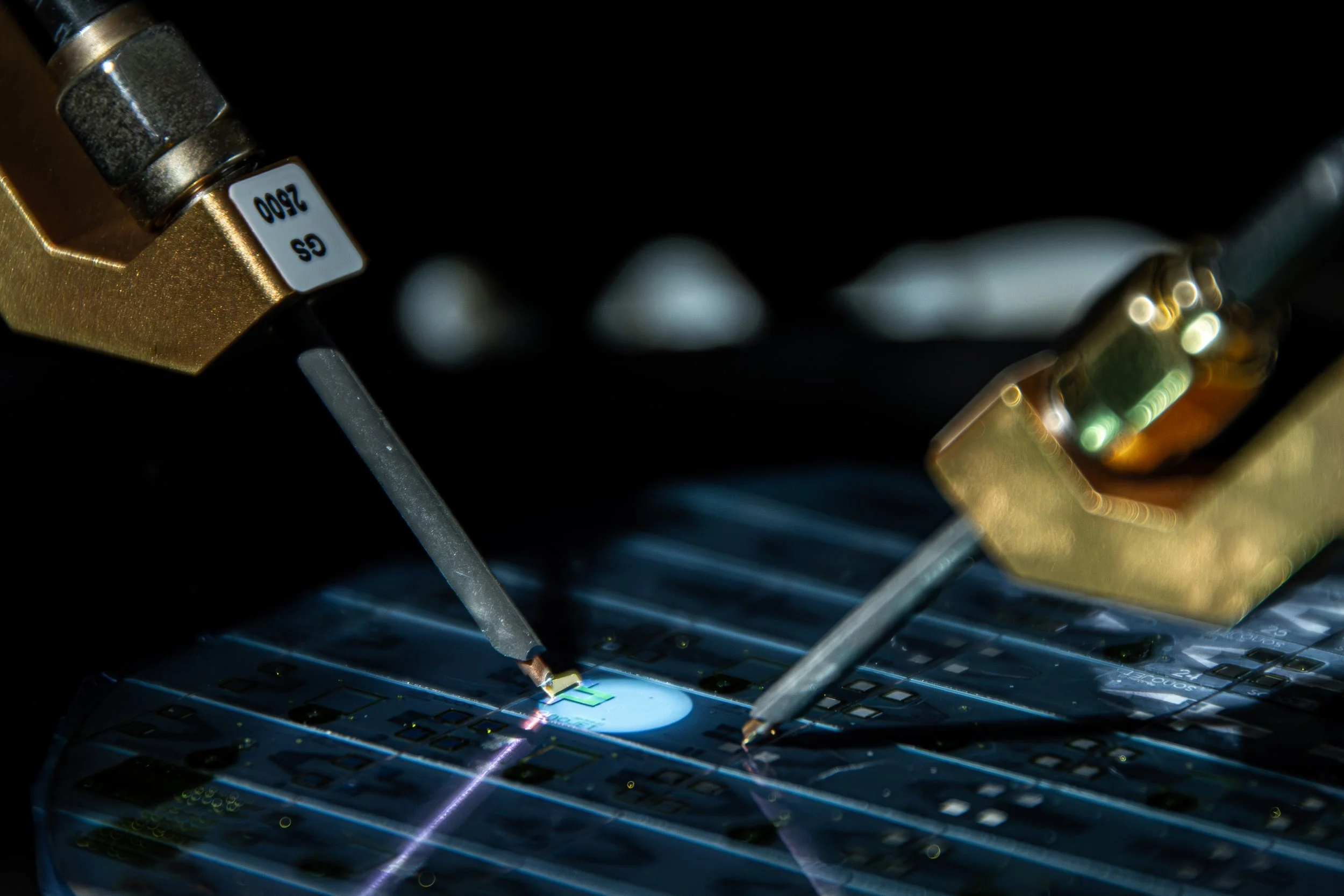 Close-up of advanced semiconductor or microchip manufacturing process with robotic equipment during photolithography.
