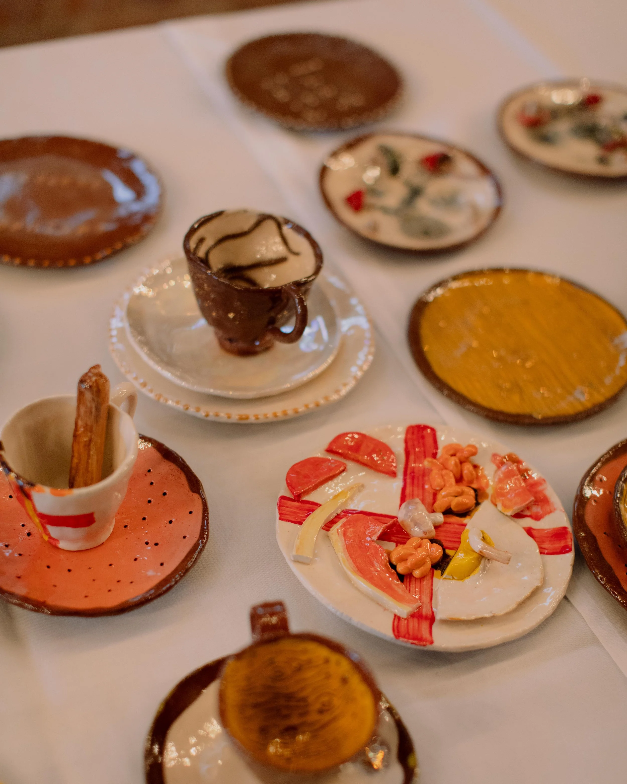 Clay cups and saucers on a tea table for the CLAY 1A event, hosted in the CLAY 1A building (Ipswich).