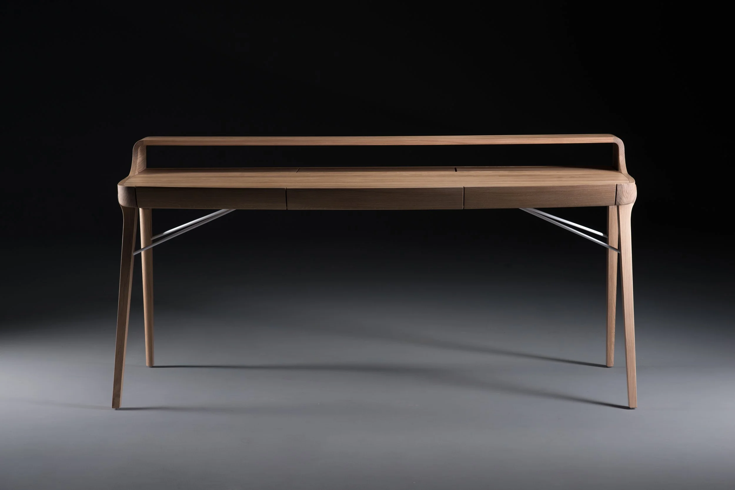 Picard Desk with soft-edged wooden body and elegant lateral legs
