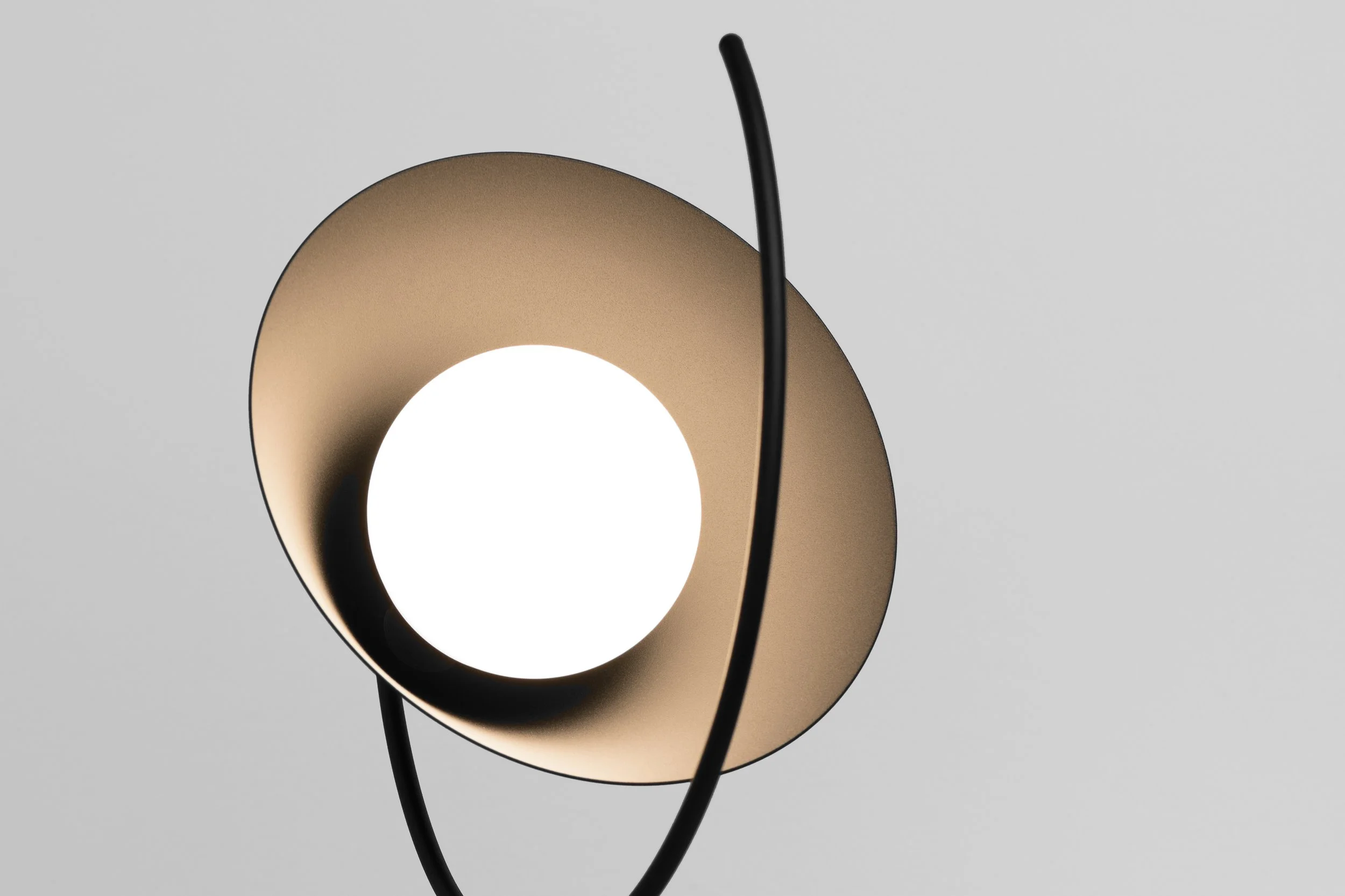 Meridian lamp projecting light along a predetermined path, combining minimalist design with a mechanism that allows the lamp to slide and create evolving compositions.