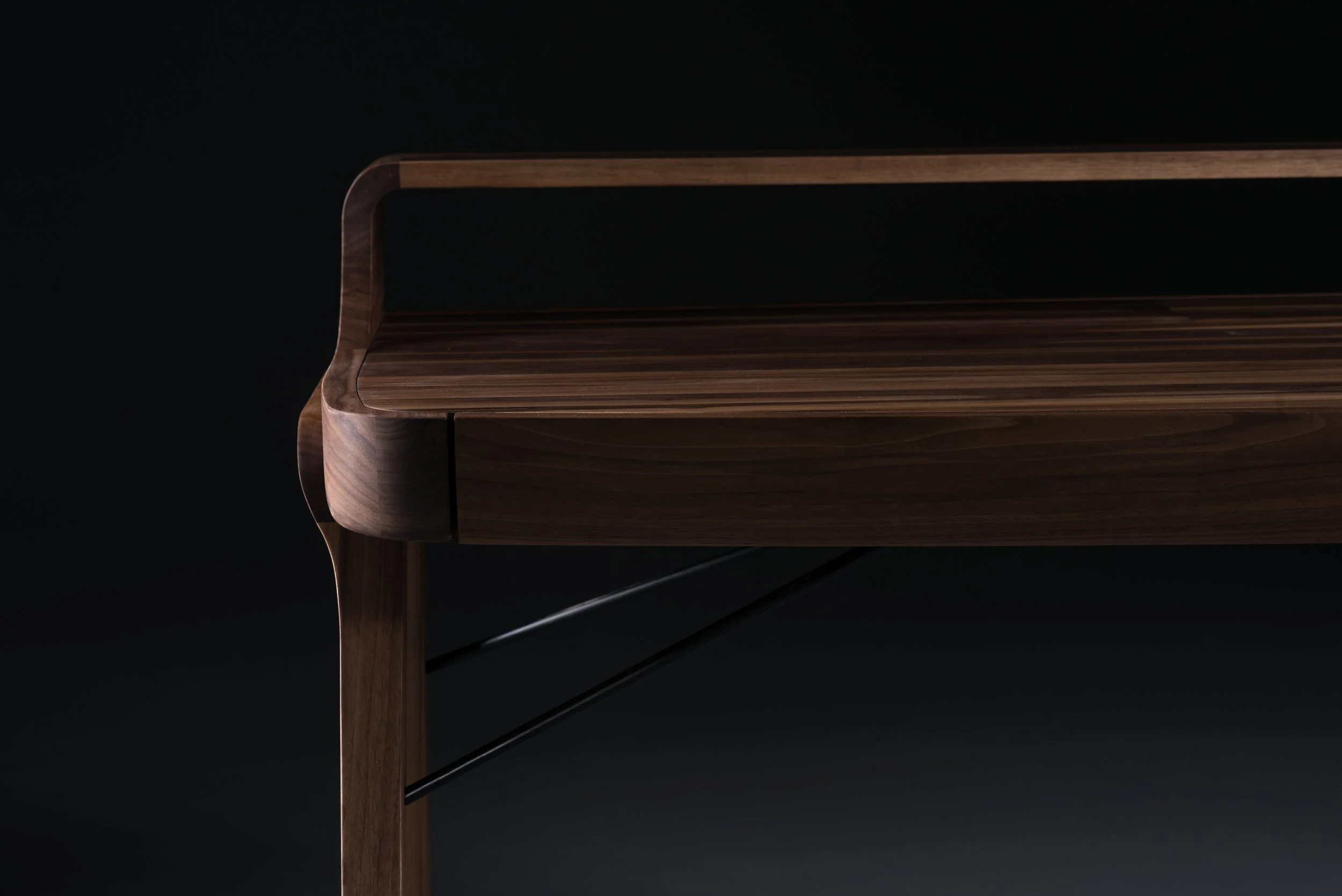 Picard Desk with soft-edged wooden body and elegant lateral legs