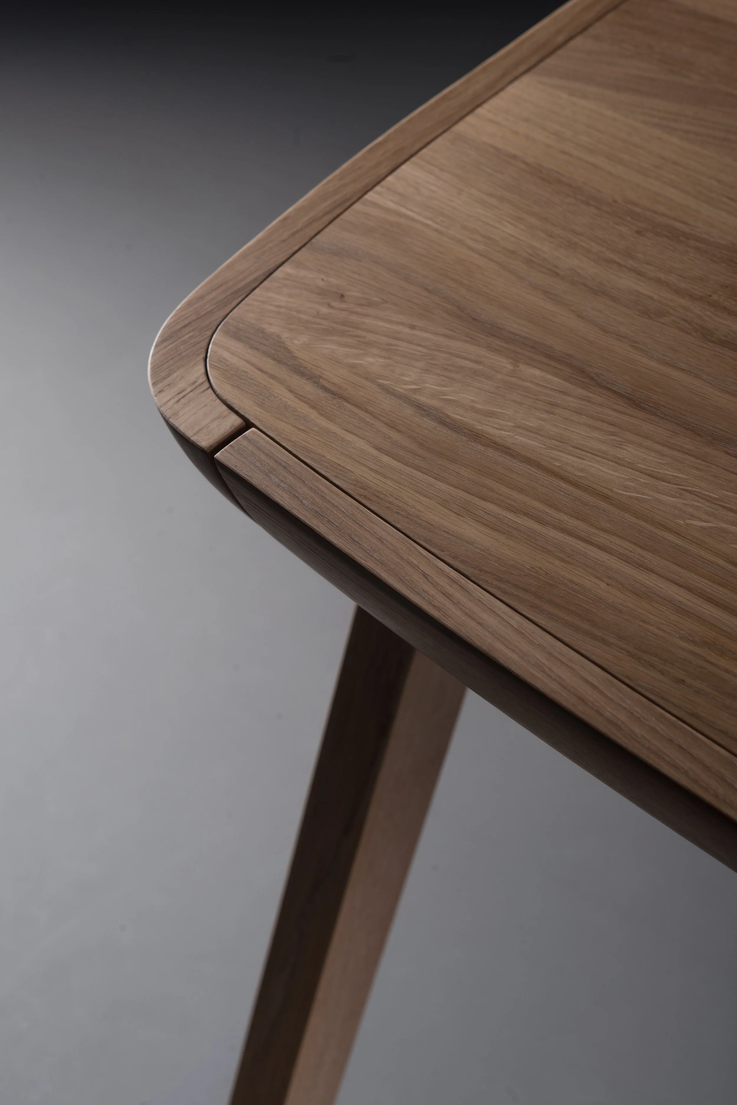 Picard Desk with soft-edged wooden body and elegant lateral legs