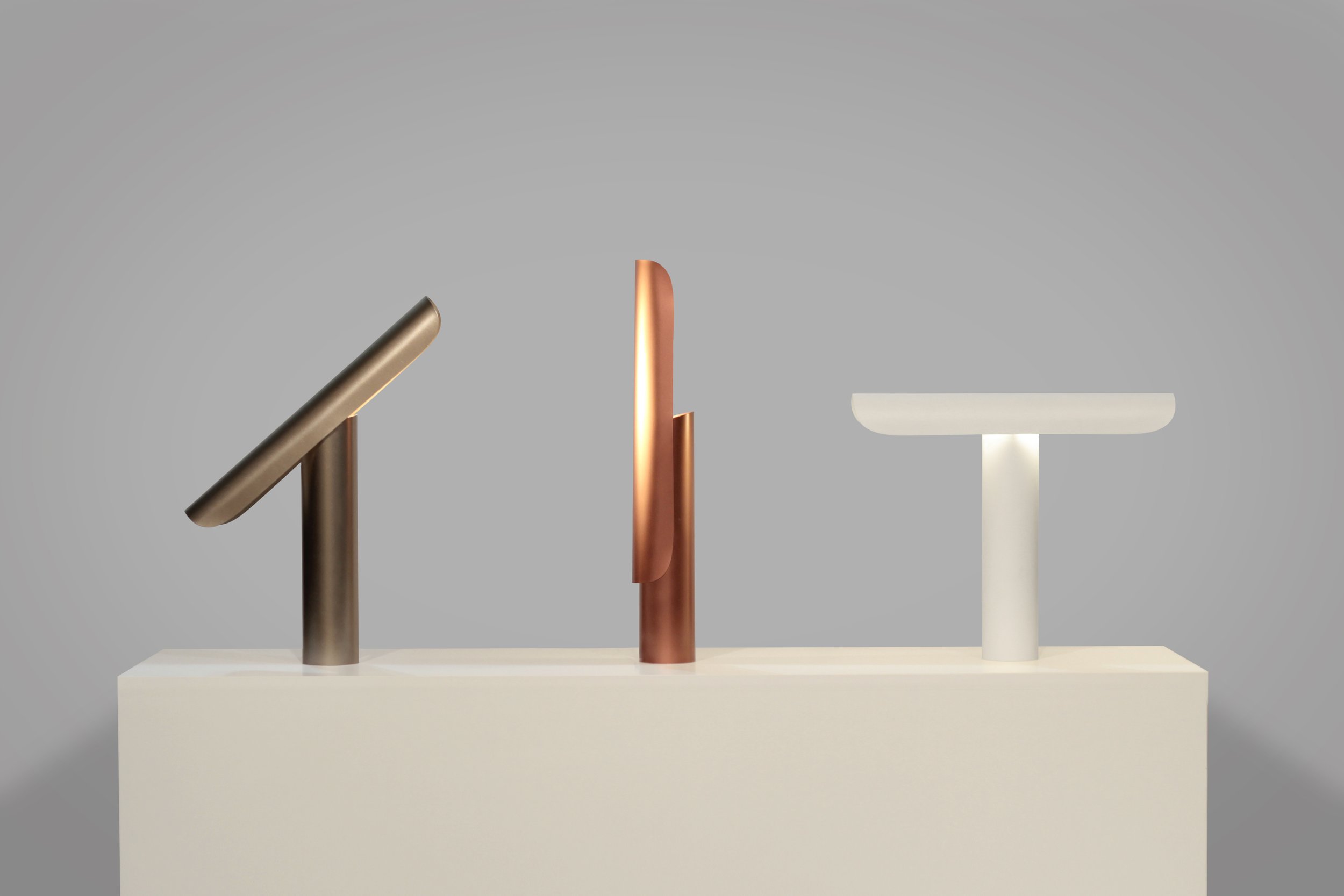 T Lamp by Regular Company for FRAMA, a monumental desk lamp with simple geometric forms and a tilting mechanism to direct light from multiple angles.