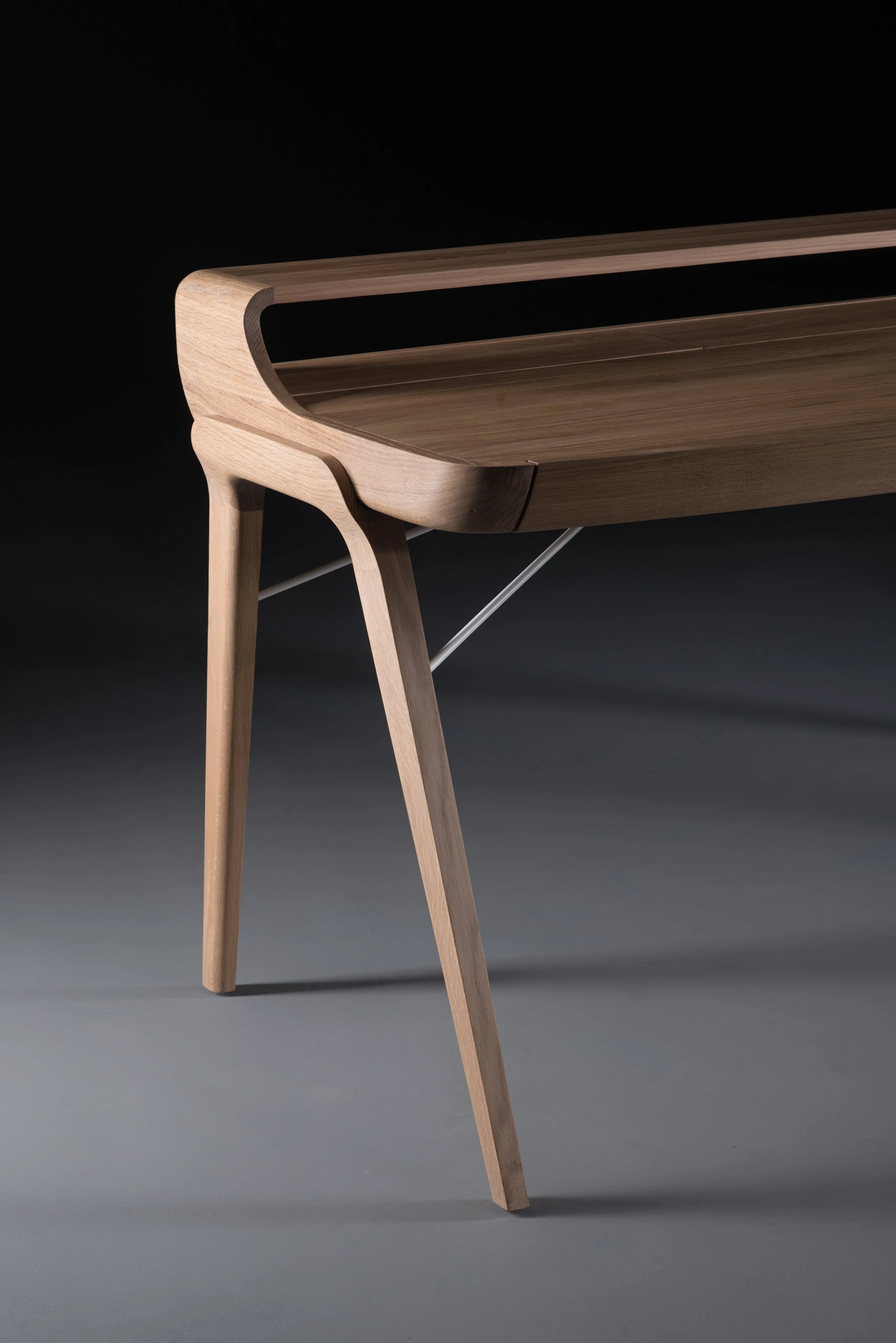 Picard Desk with soft-edged wooden body and elegant lateral legs