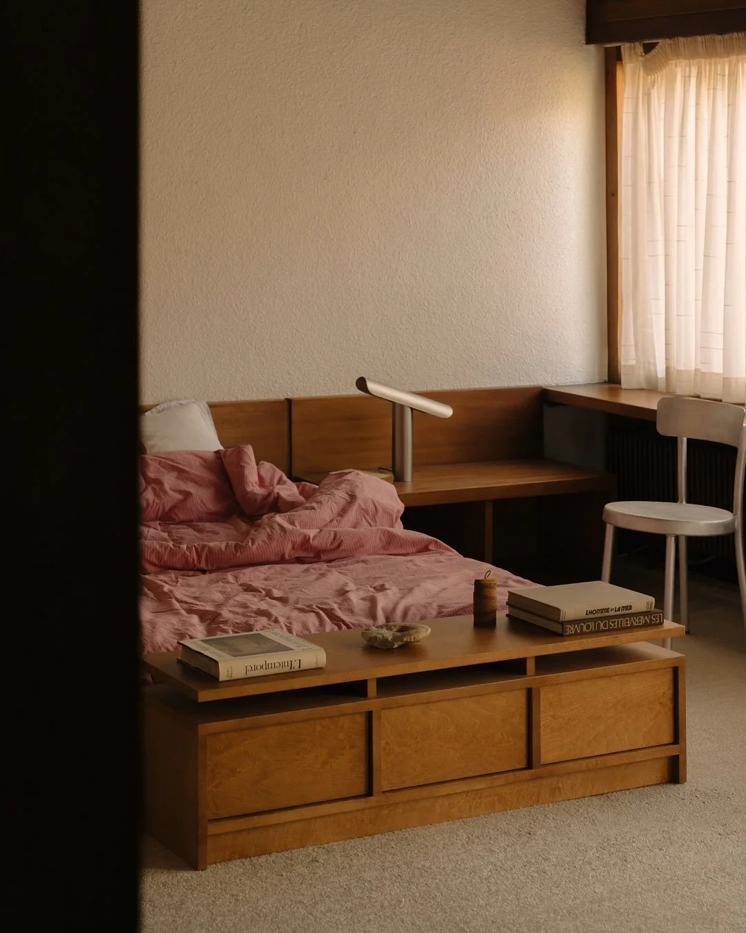 Detail of T Lamp showing its tilting mechanism, allowing adjustable light direction while maintaining a minimalist, geometric design.