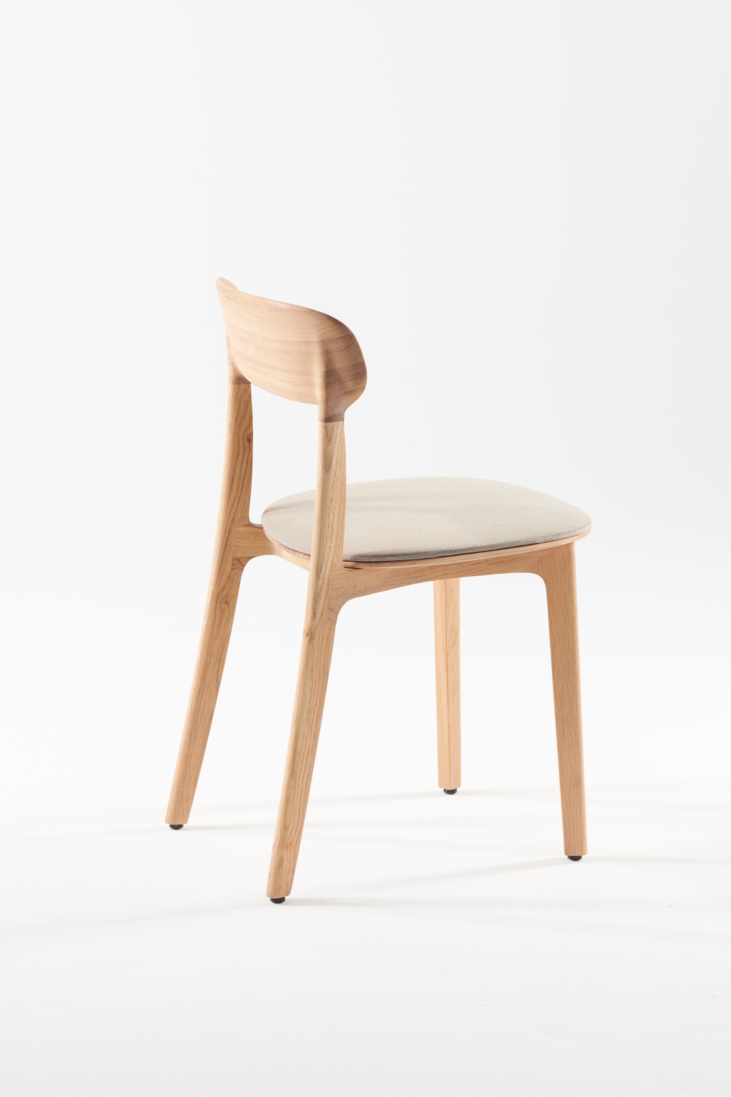 Tanka Chair with elegant curved wooden back legs