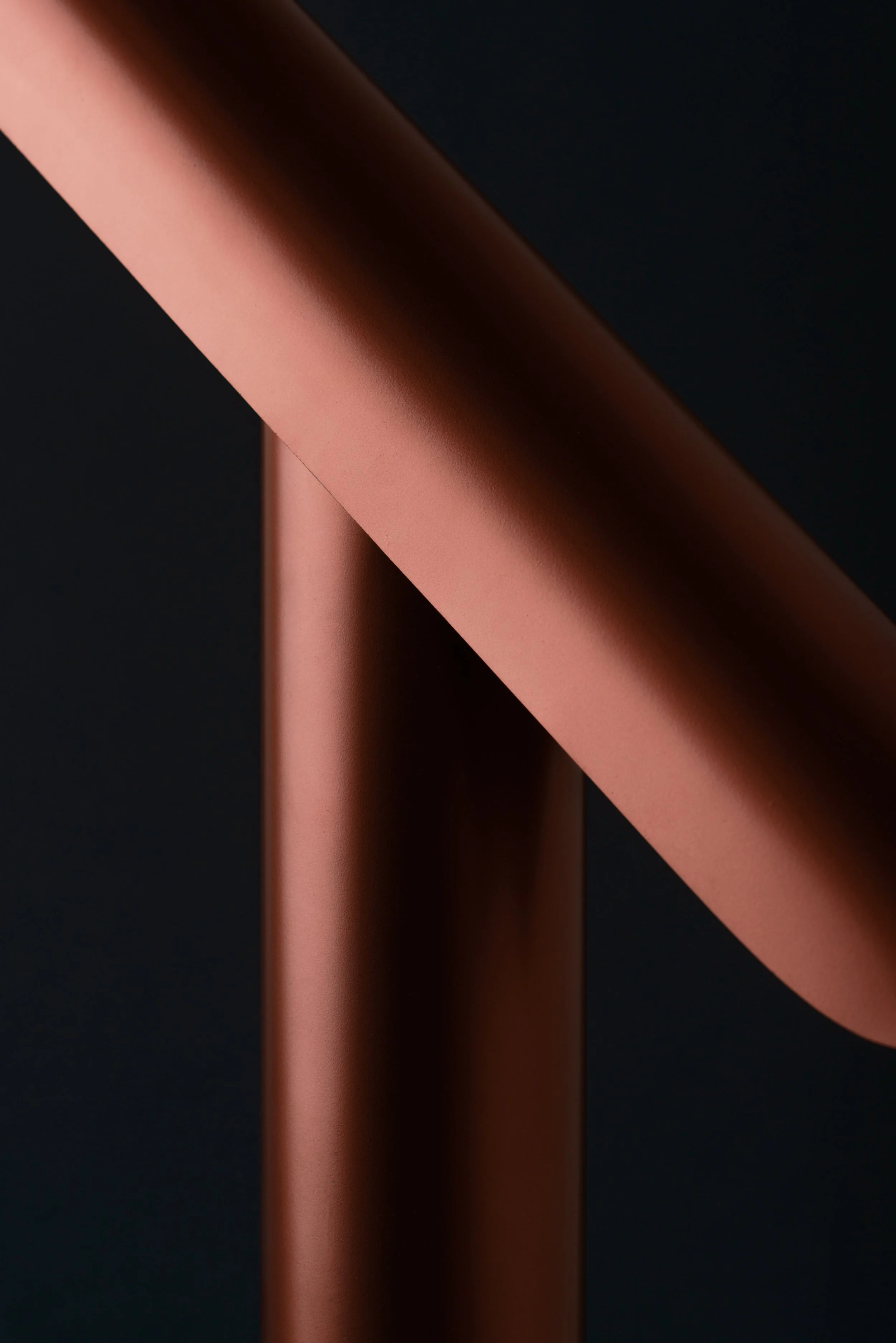 Detail of T Lamp showing its tilting mechanism, allowing adjustable light direction while maintaining a minimalist, geometric design.