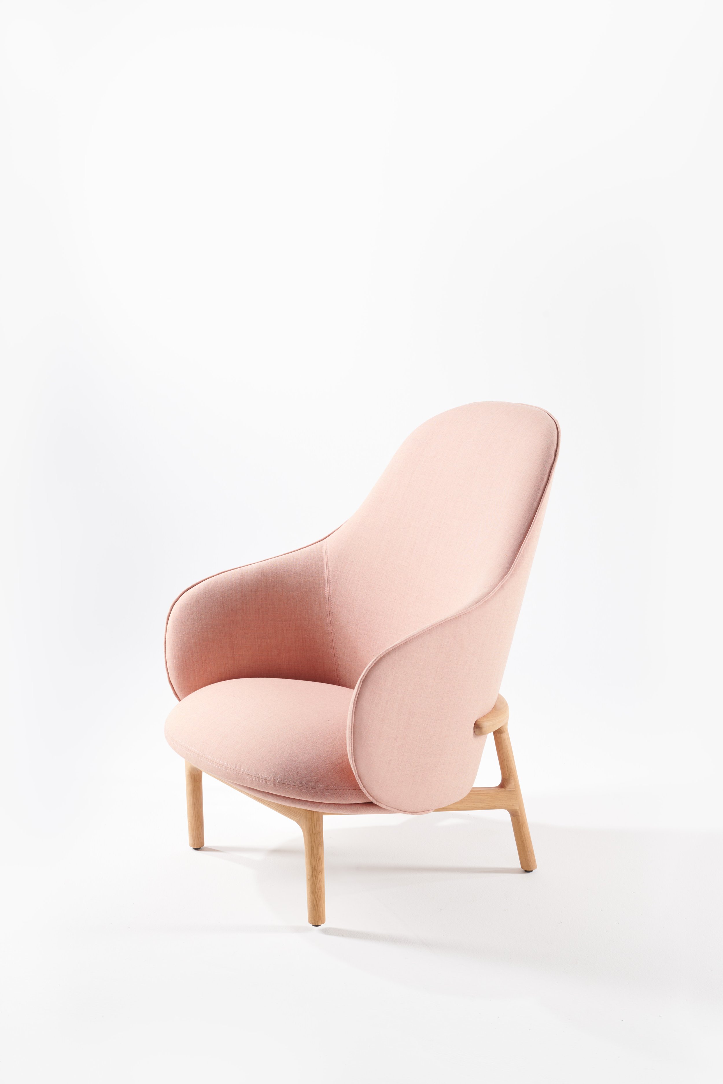 Mela lounge collection featuring an armchair, lounge chair, and sofa with upholstered seats and solid wood frames.