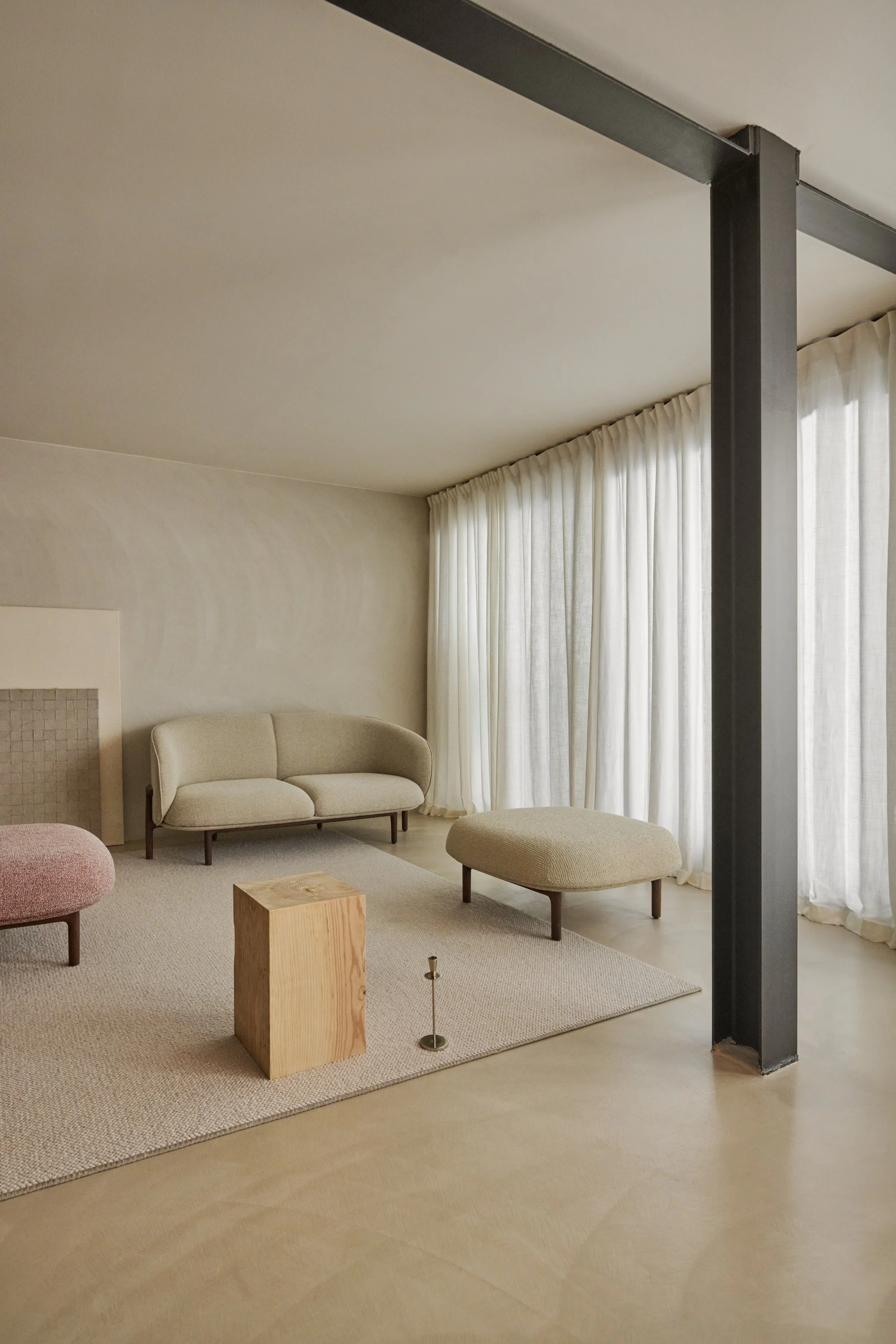 Close-up of the Mela Lounge Two-Seater’s solid wood frame, emphasizing precise joinery and natural wood finish.