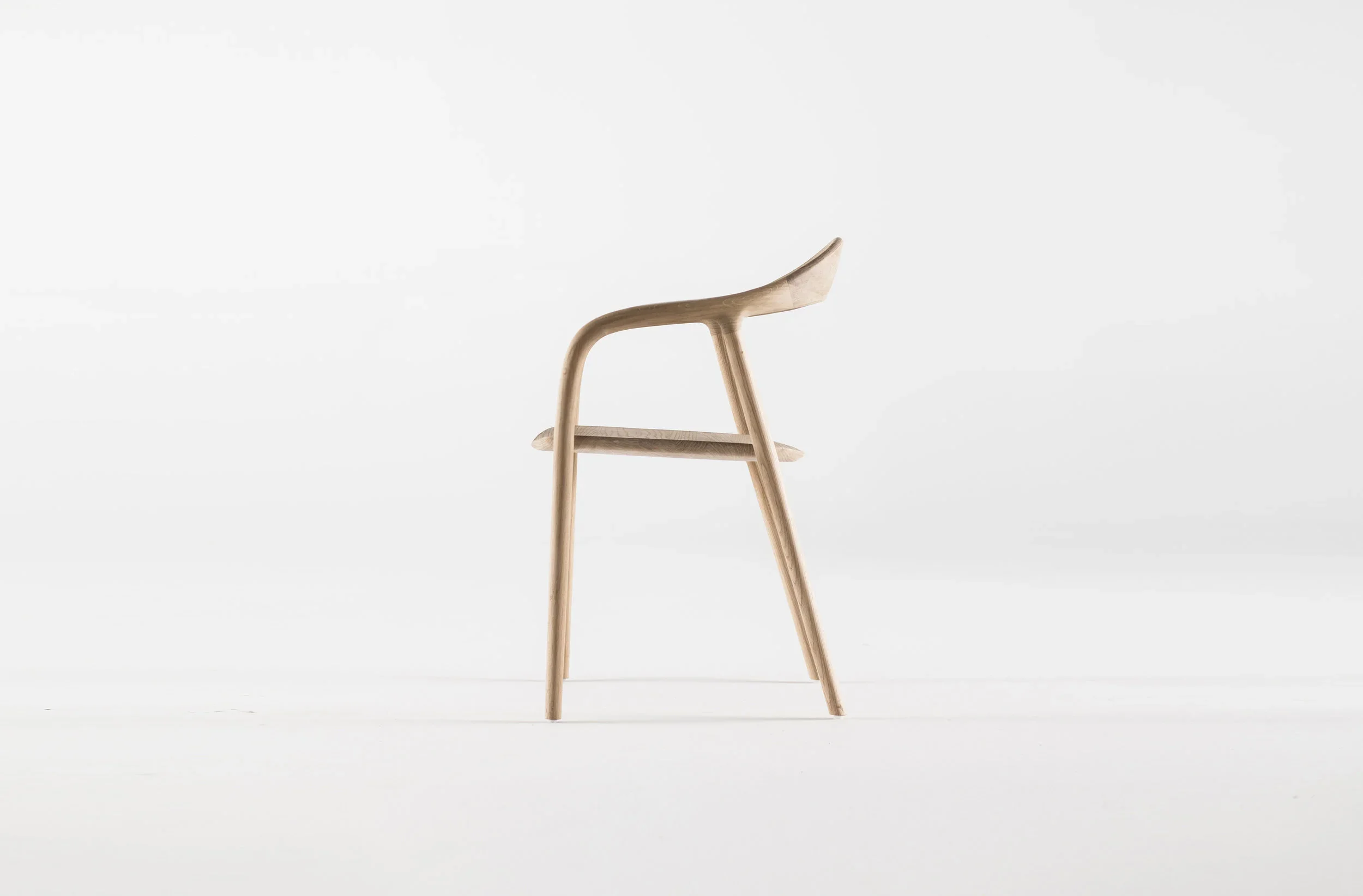 Neva Chair by Regular Company – modern solid wood chair with sculptural, fluid lines