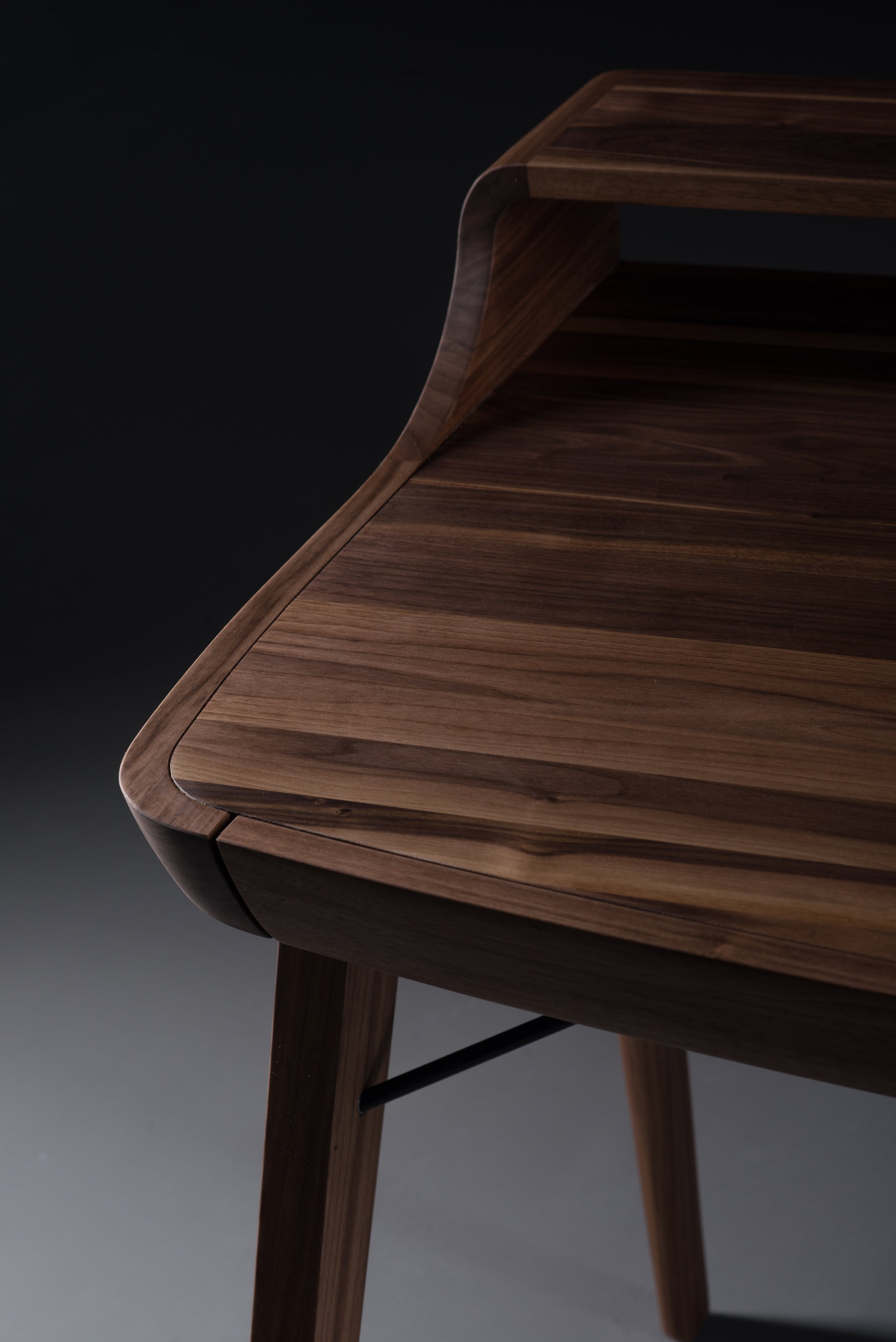 Picard Desk with soft-edged wooden body and elegant lateral legs