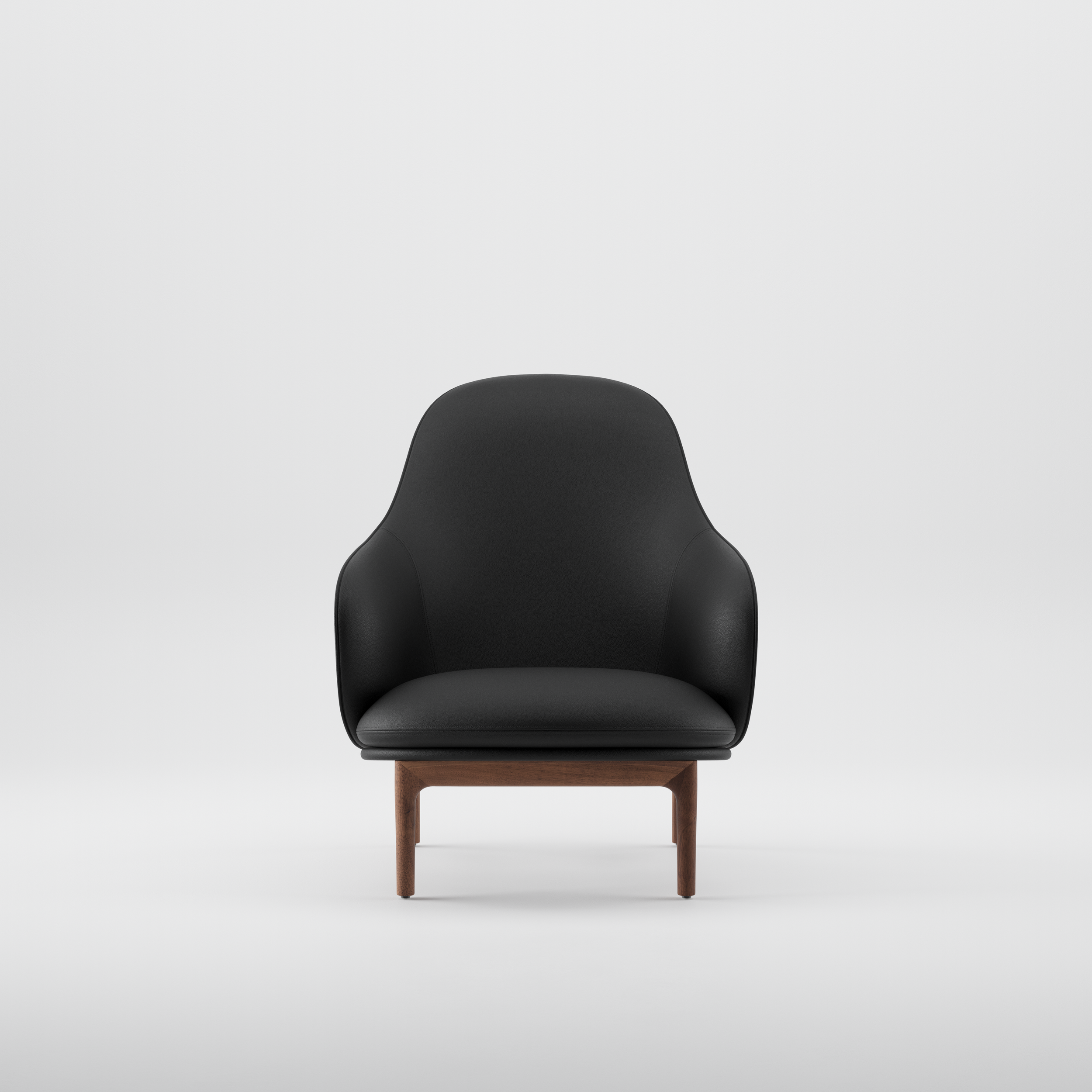 Mela lounge chair featuring flowing upholstered forms and a precisely crafted wooden base.