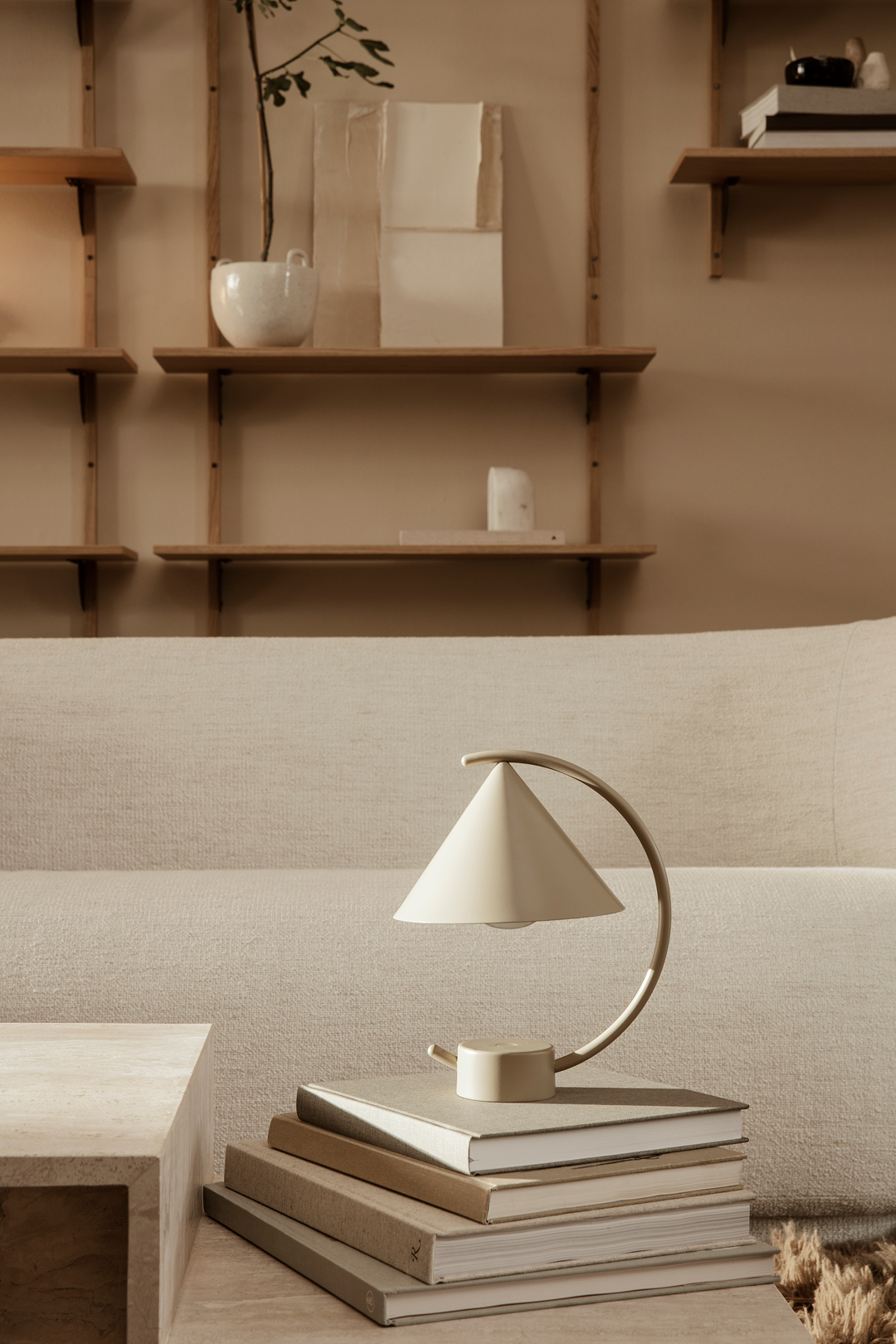 Detail of Meridian lamp showing its sliding base mechanism, enabling the lamp to shift position and create varied sculptural light compositions.
