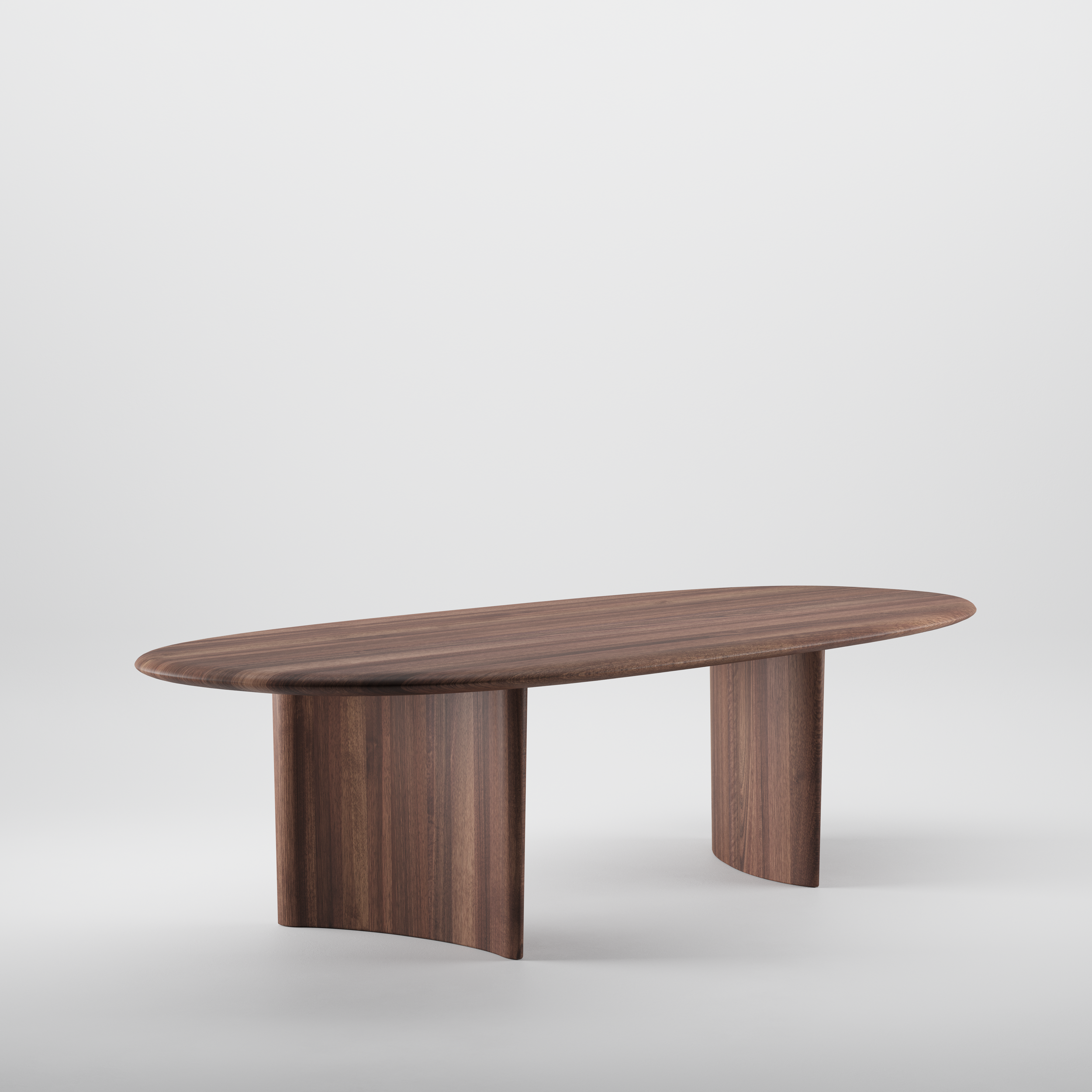 Monument Table with a uniquely shaped solid wood top and angled legs, combining functional furniture with sculptural design.