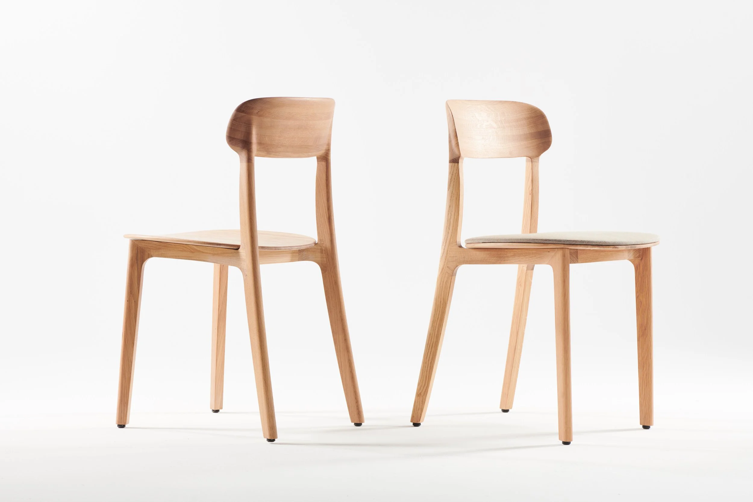 Tanka Chair with elegant curved wooden back legs