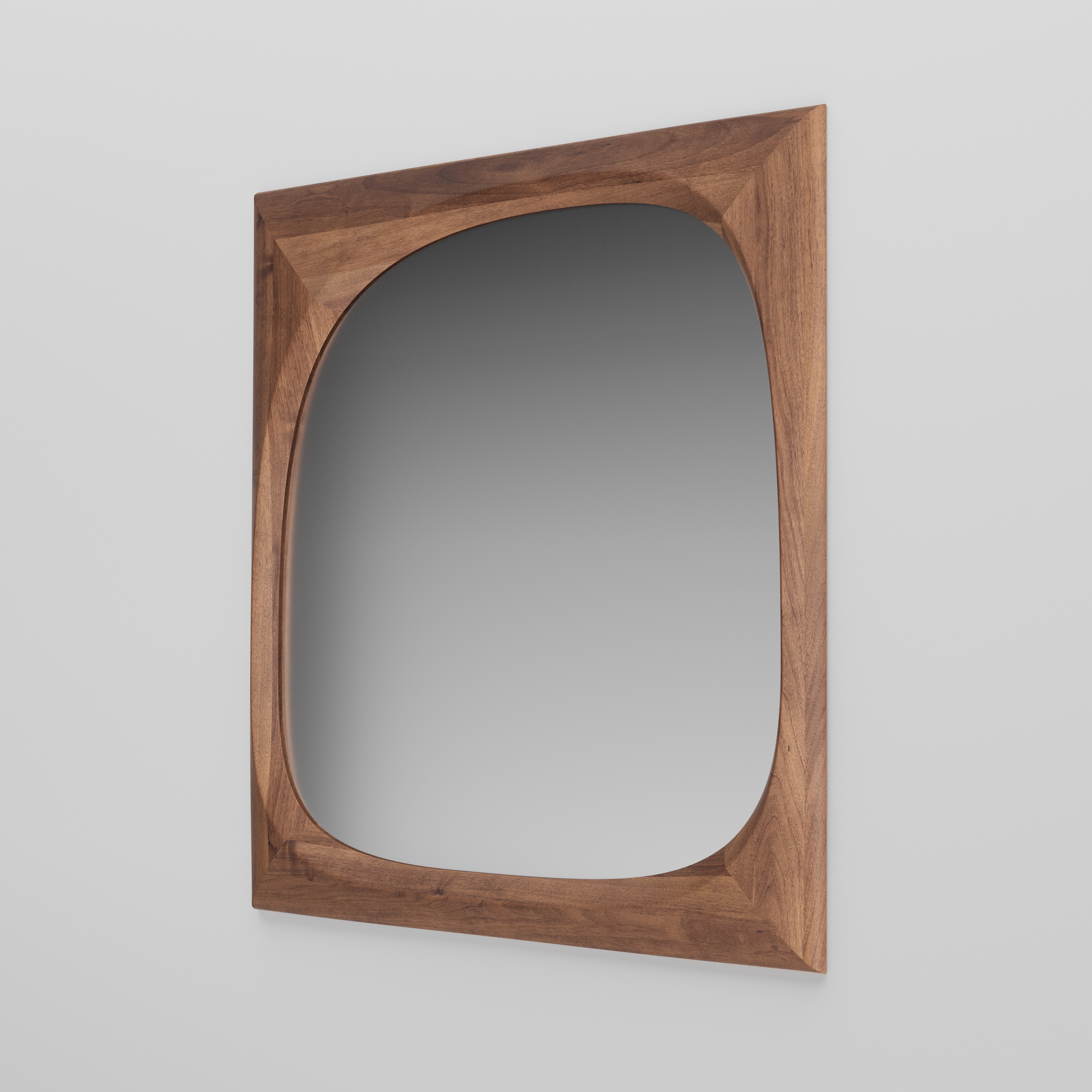 Monument Mirror shown front-facing, featuring a large, irregularly shaped wooden frame in a natural finish.