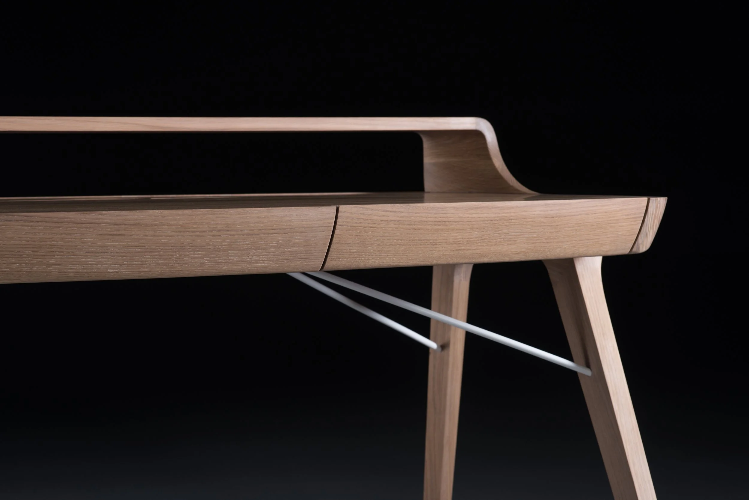 Picard Desk with soft-edged wooden body and elegant lateral legs