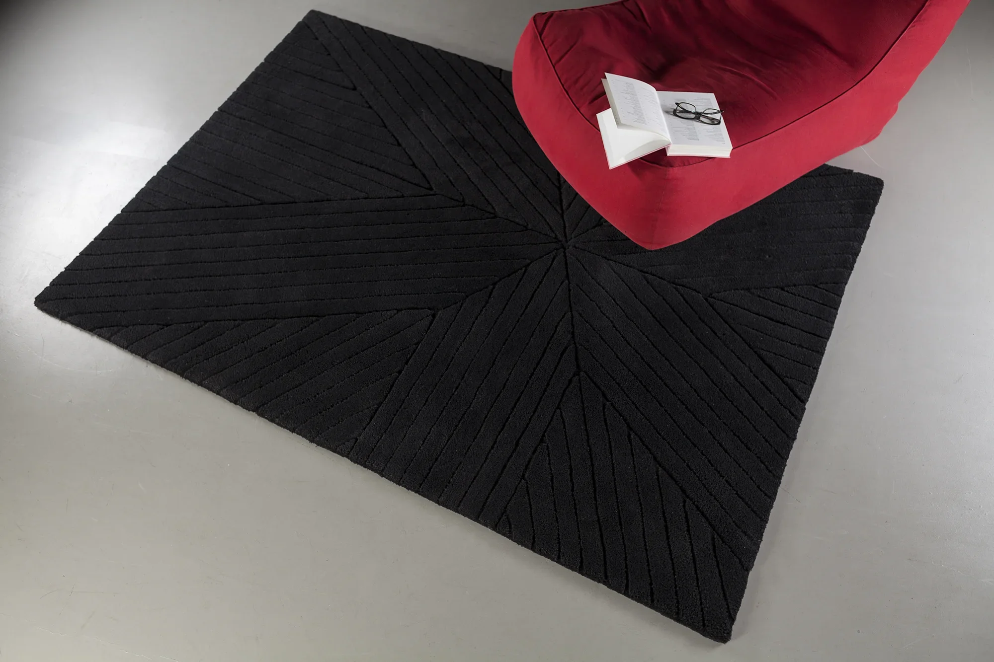 Hand-tufted Artisan rug with textured relief design