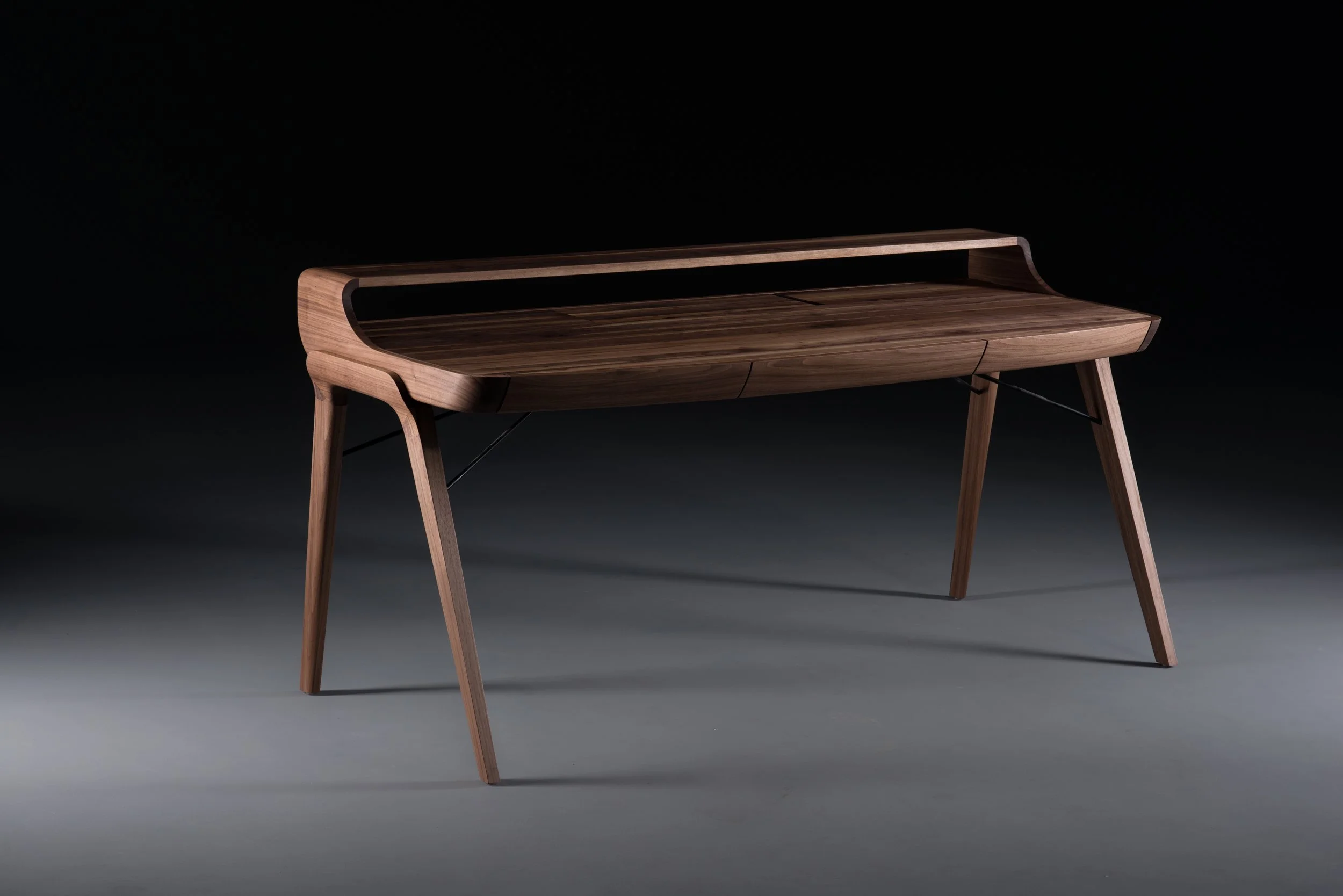 Picard Desk with soft-edged wooden body and elegant lateral legs