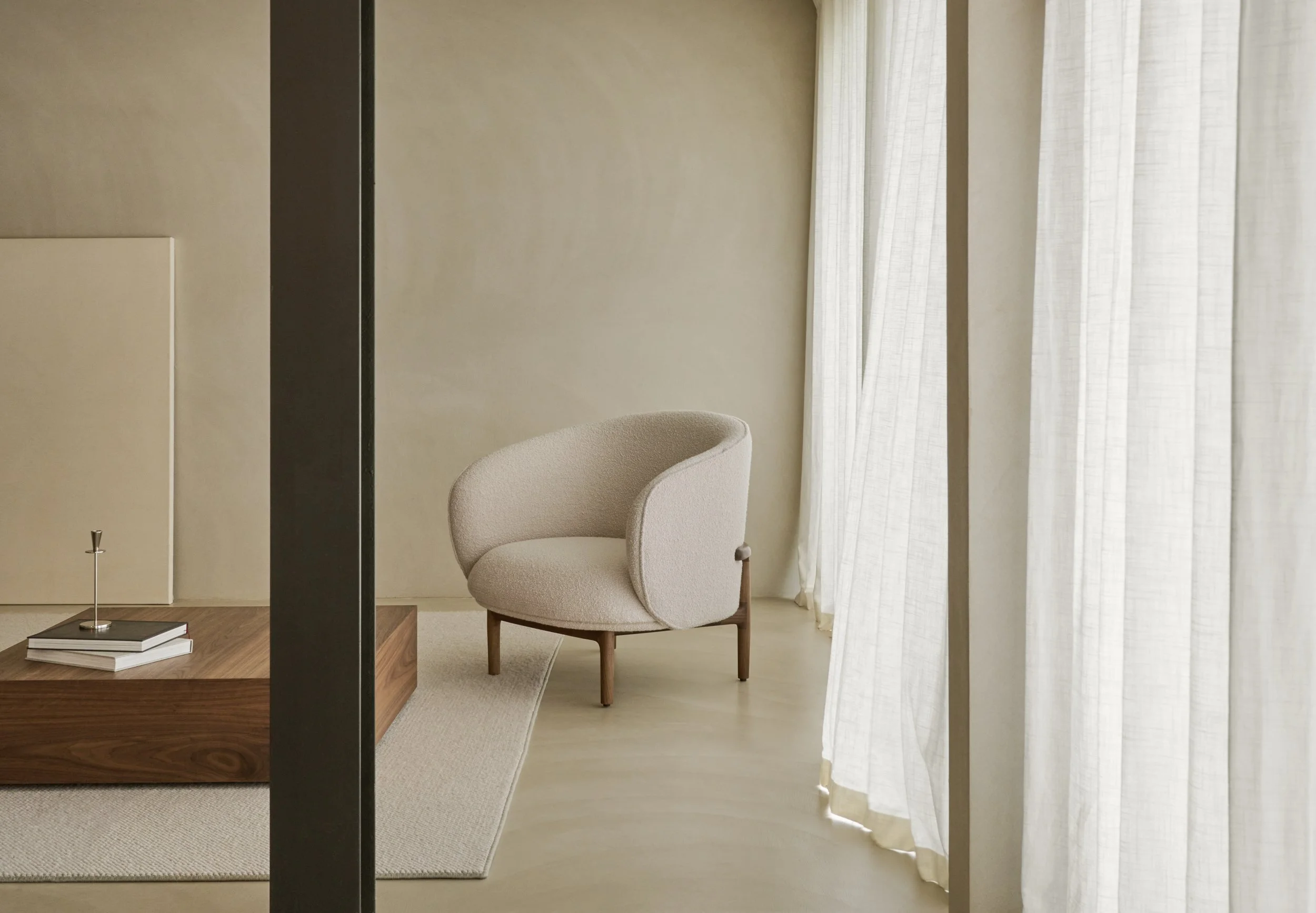 Mela Lounge Trimmed from Artisan’s Mela collection, blending graceful forms, comfort, and solid wood craftsmanship.