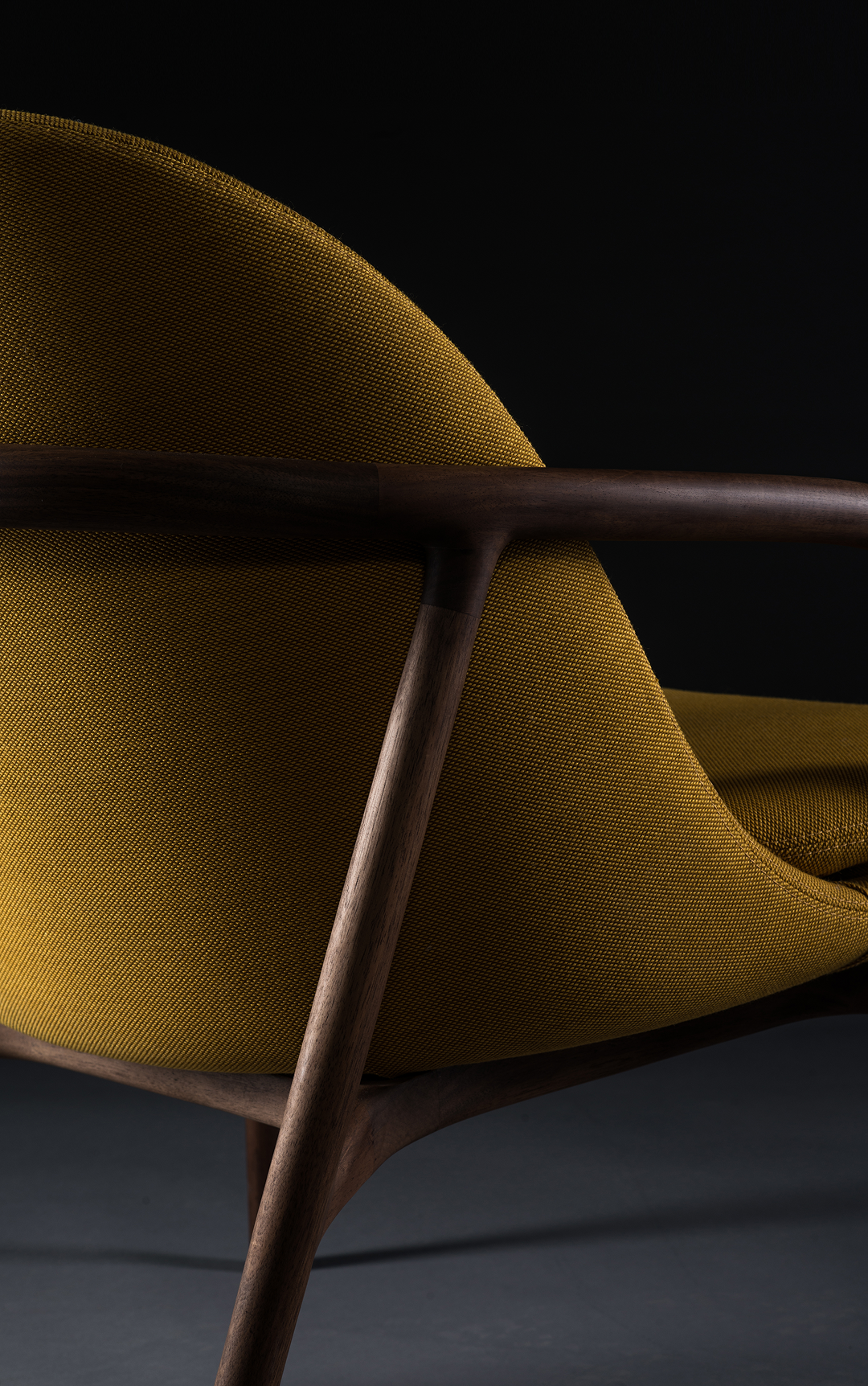 Low-back lounge chair with flowing lines and organic curves