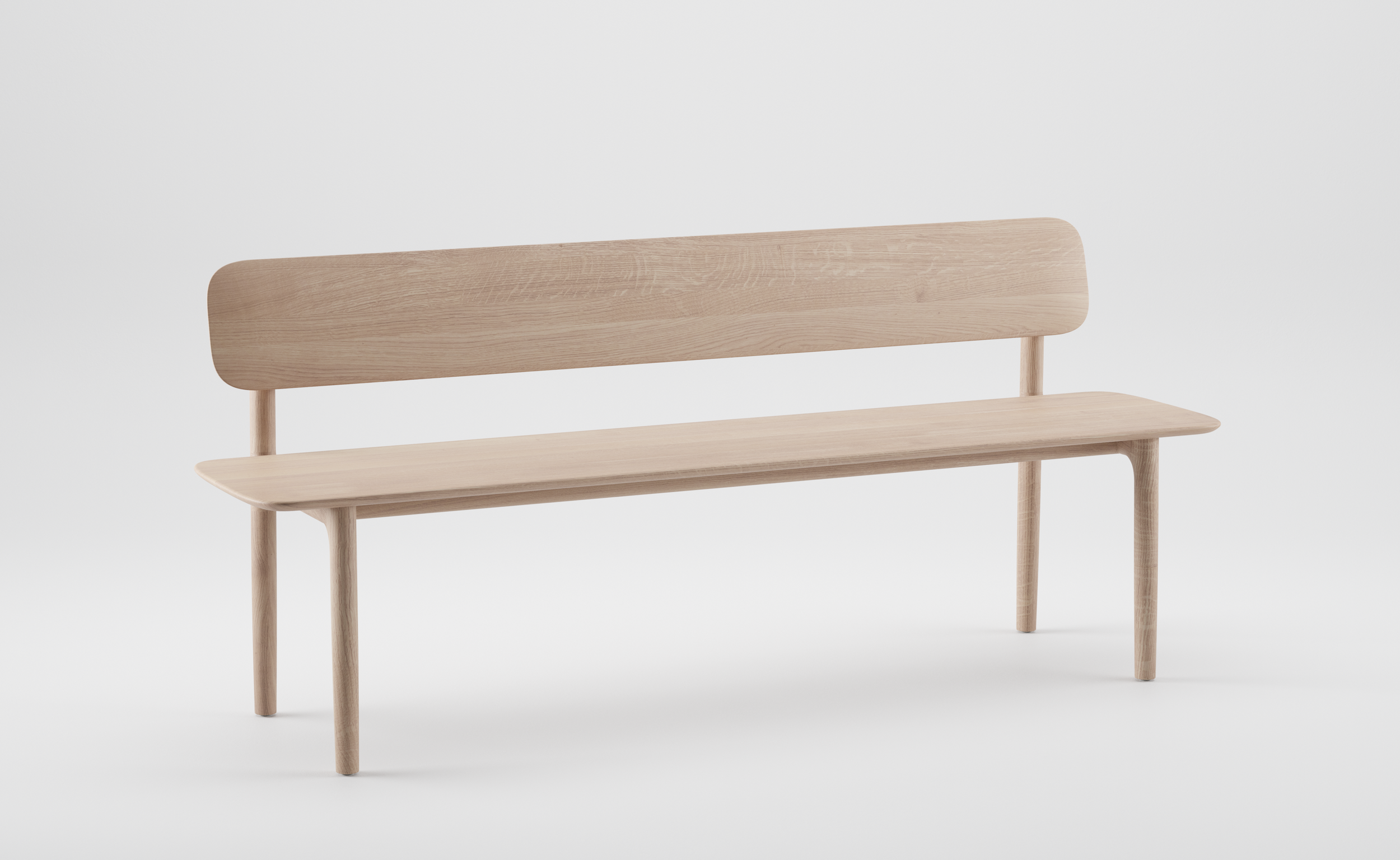 Sculptural wooden bench with a flowing backrest and upholstered seat from the Neva collection.