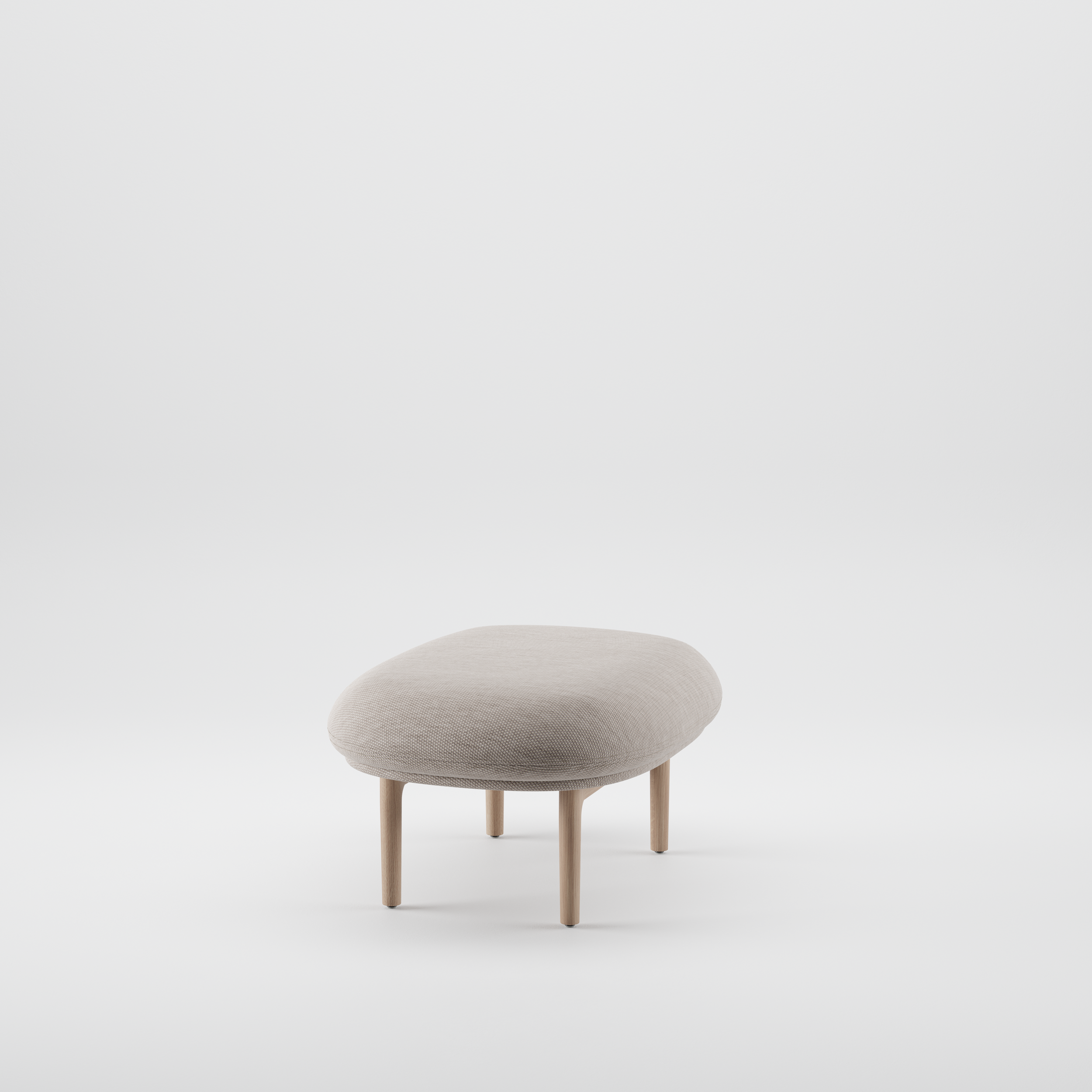 Three-quarter view of the Mela Ottoman showing its upholstered seat and precisely crafted wooden base.