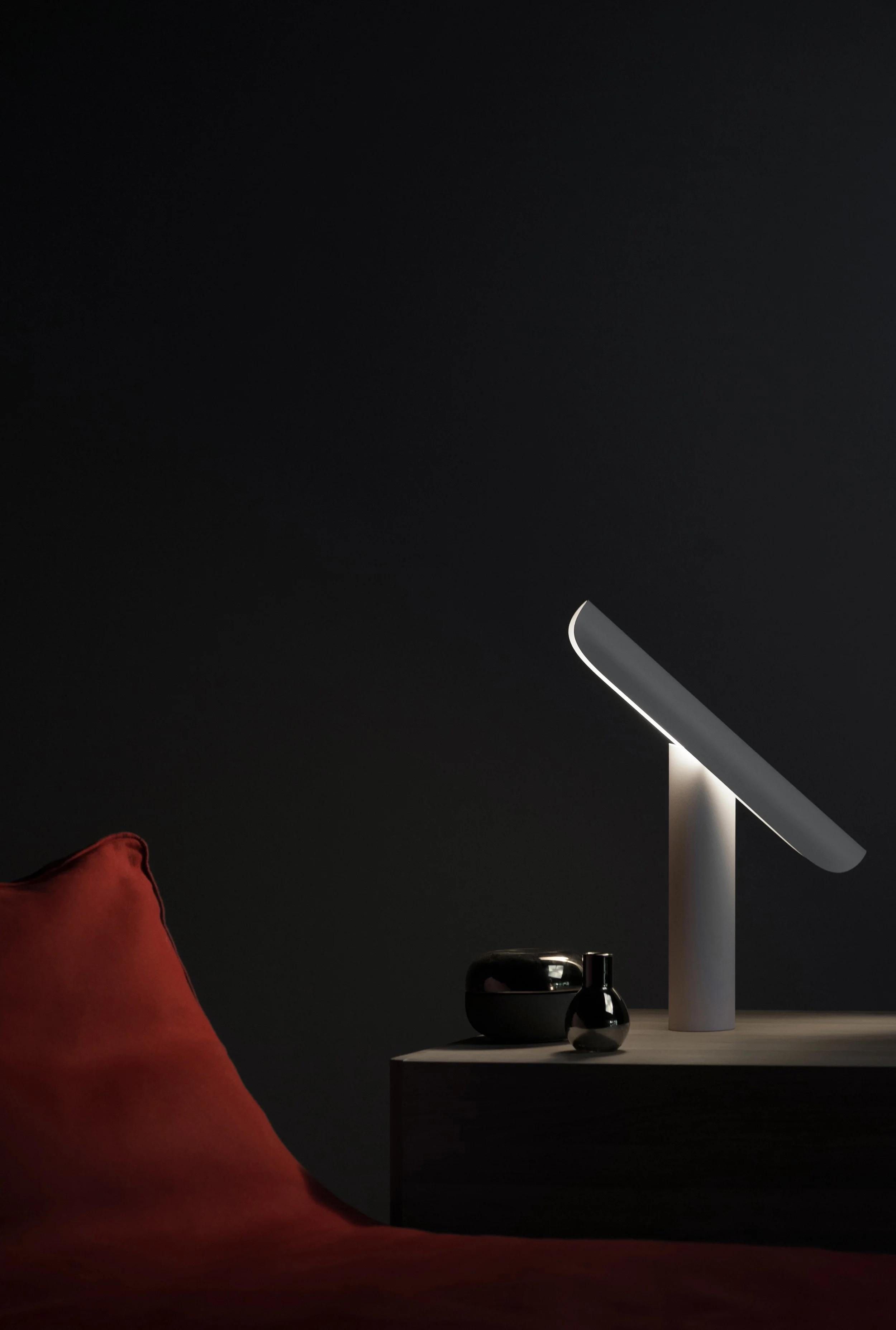 T Lamp by Regular Company for FRAMA, a monumental desk lamp with simple geometric forms and a tilting mechanism to direct light from multiple angles
