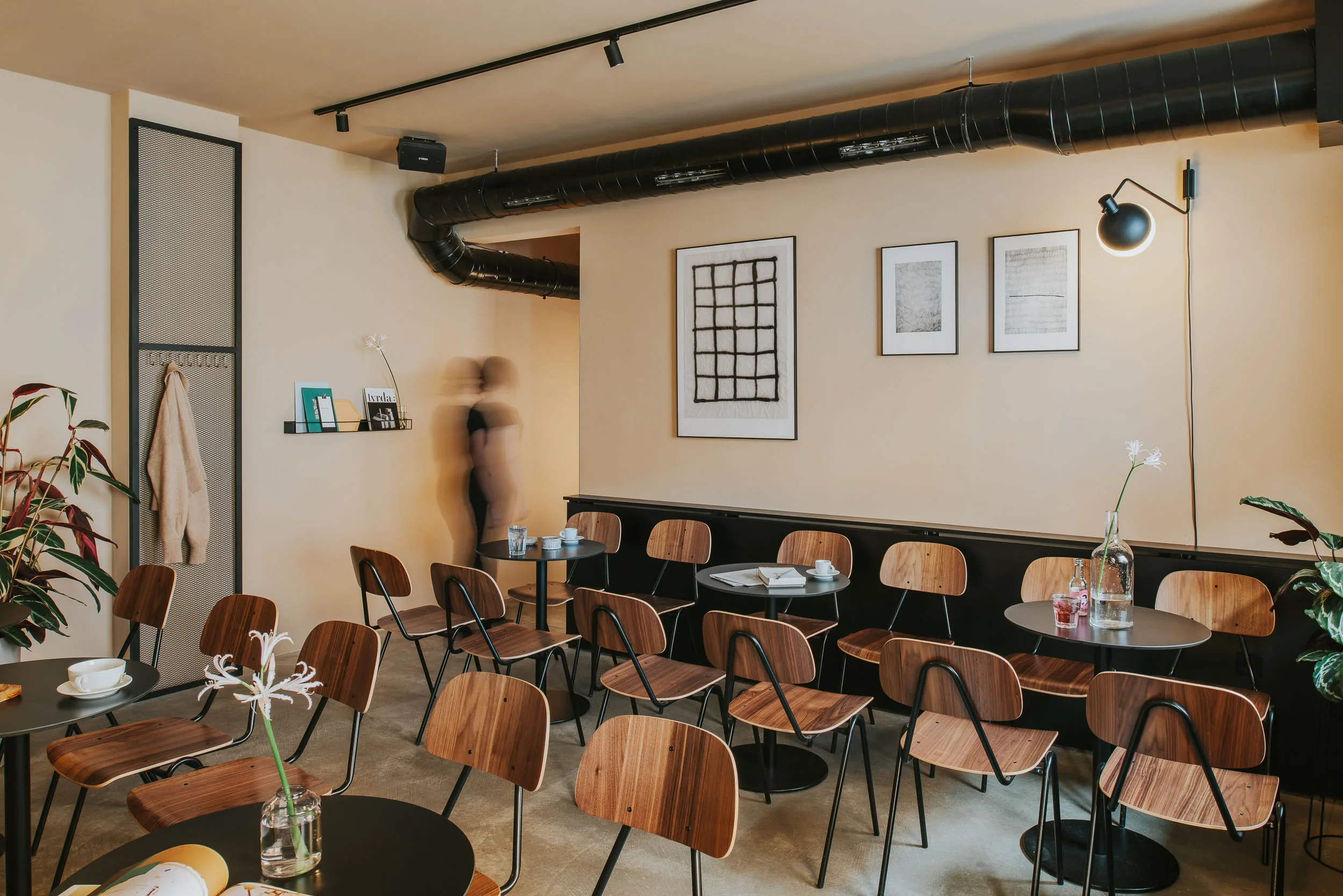 Minimalist café-bar-gallery hybrid space in Zagreb