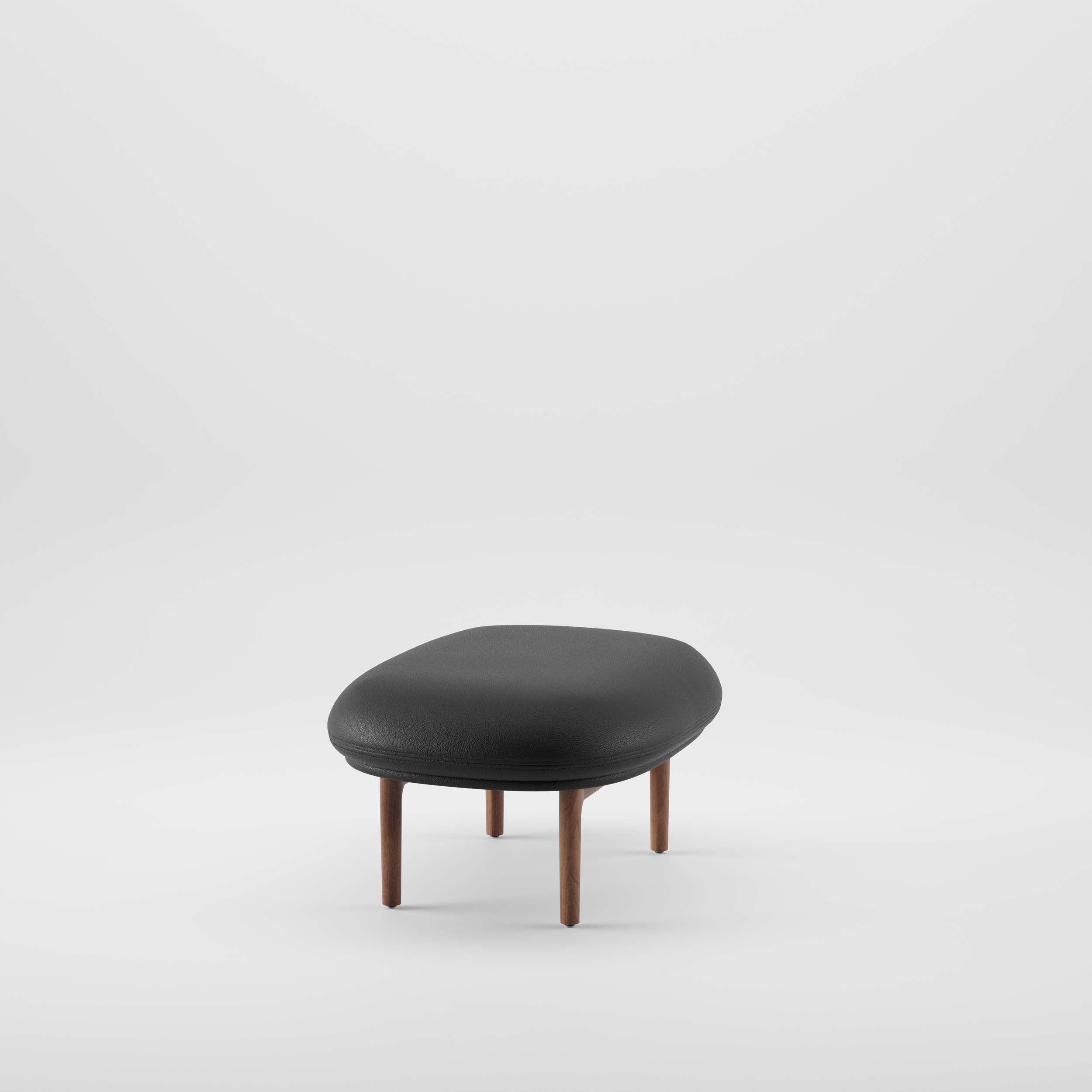Side view of the Mela Ottoman highlighting its solid wood frame and cushioned upholstered top.