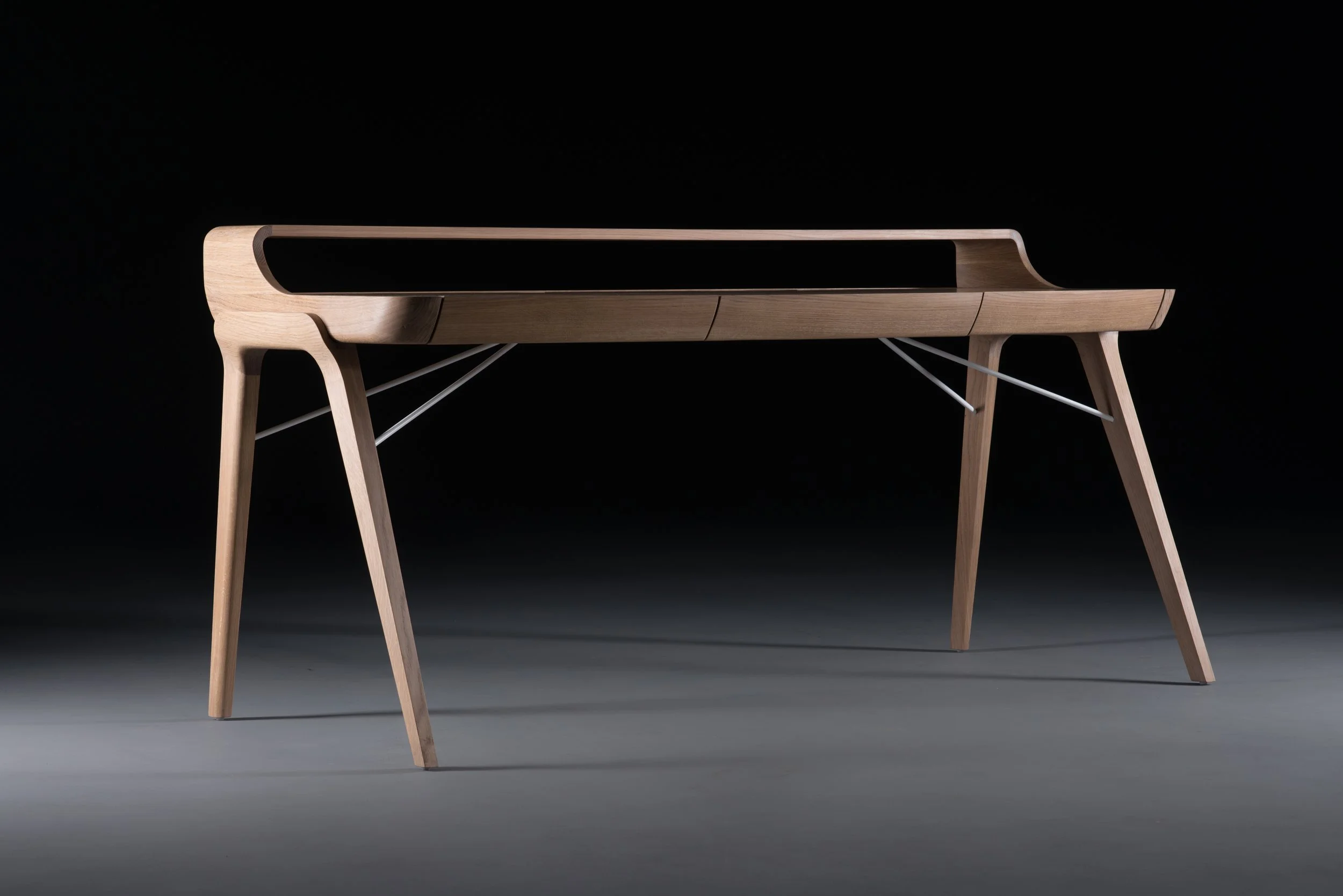 Picard Desk with soft-edged wooden body and elegant lateral legs