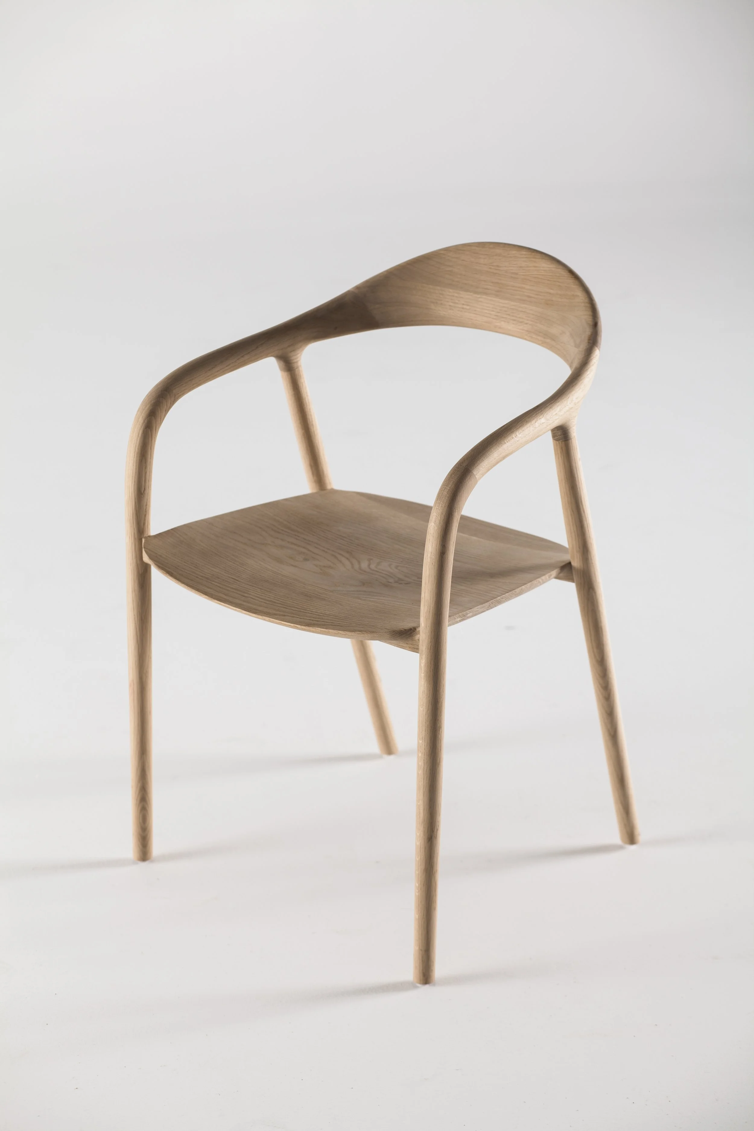 Neva Chair by Regular Company – modern solid wood chair with sculptural, fluid lines