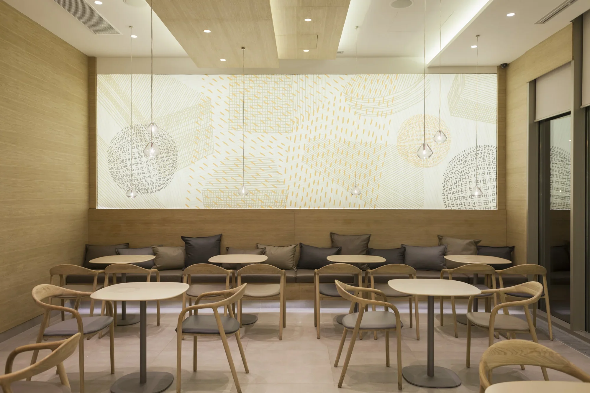 Vincek Bundek café interior with minimalist wooden ceiling panels