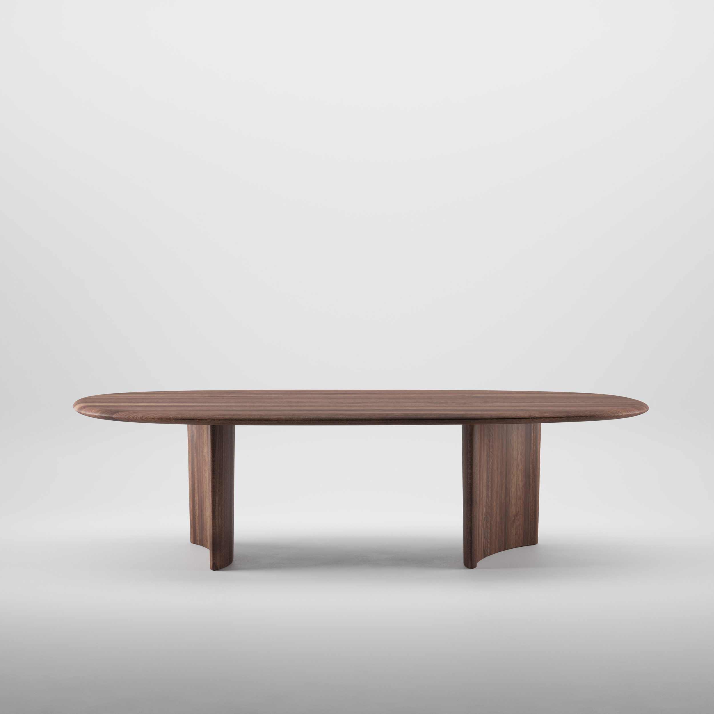 Three-quarter view of the Monument Table, showing its irregular wooden top and dynamic angled legs.