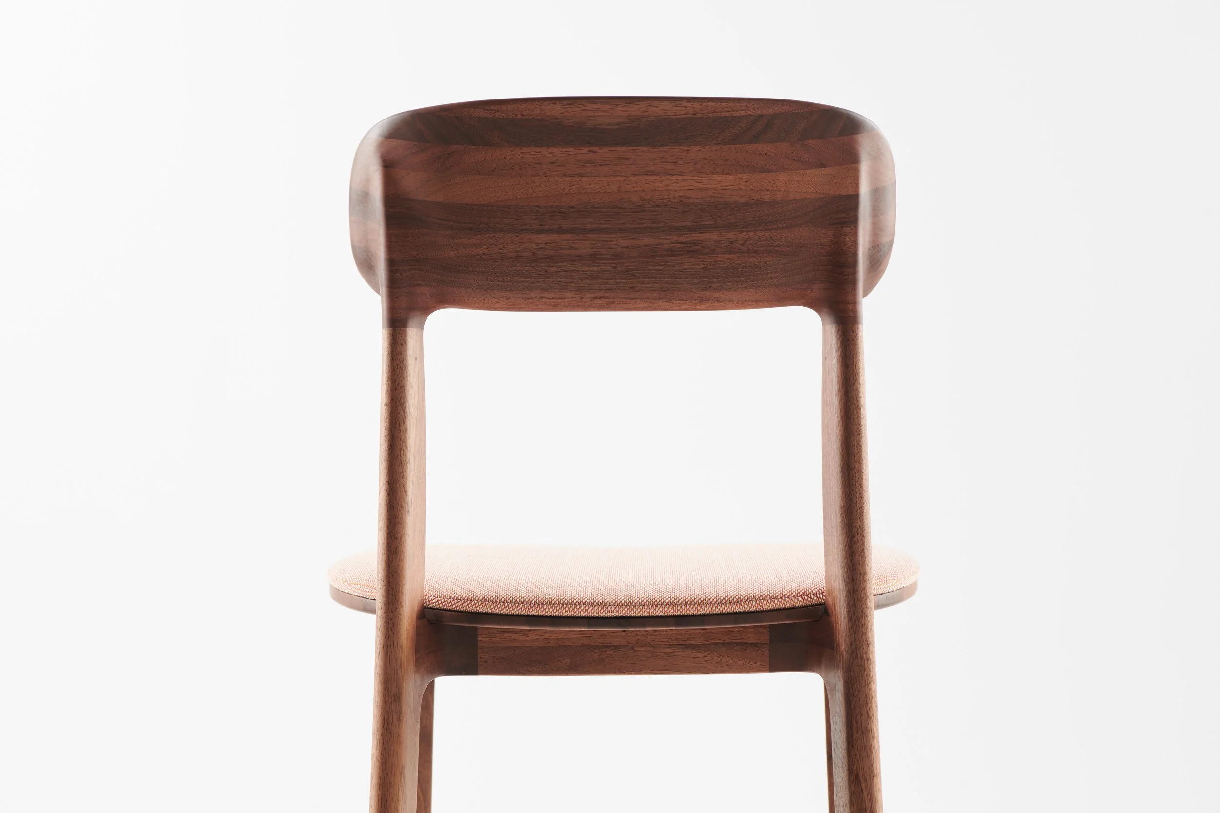 Tanka Chair with elegant curved wooden back legs