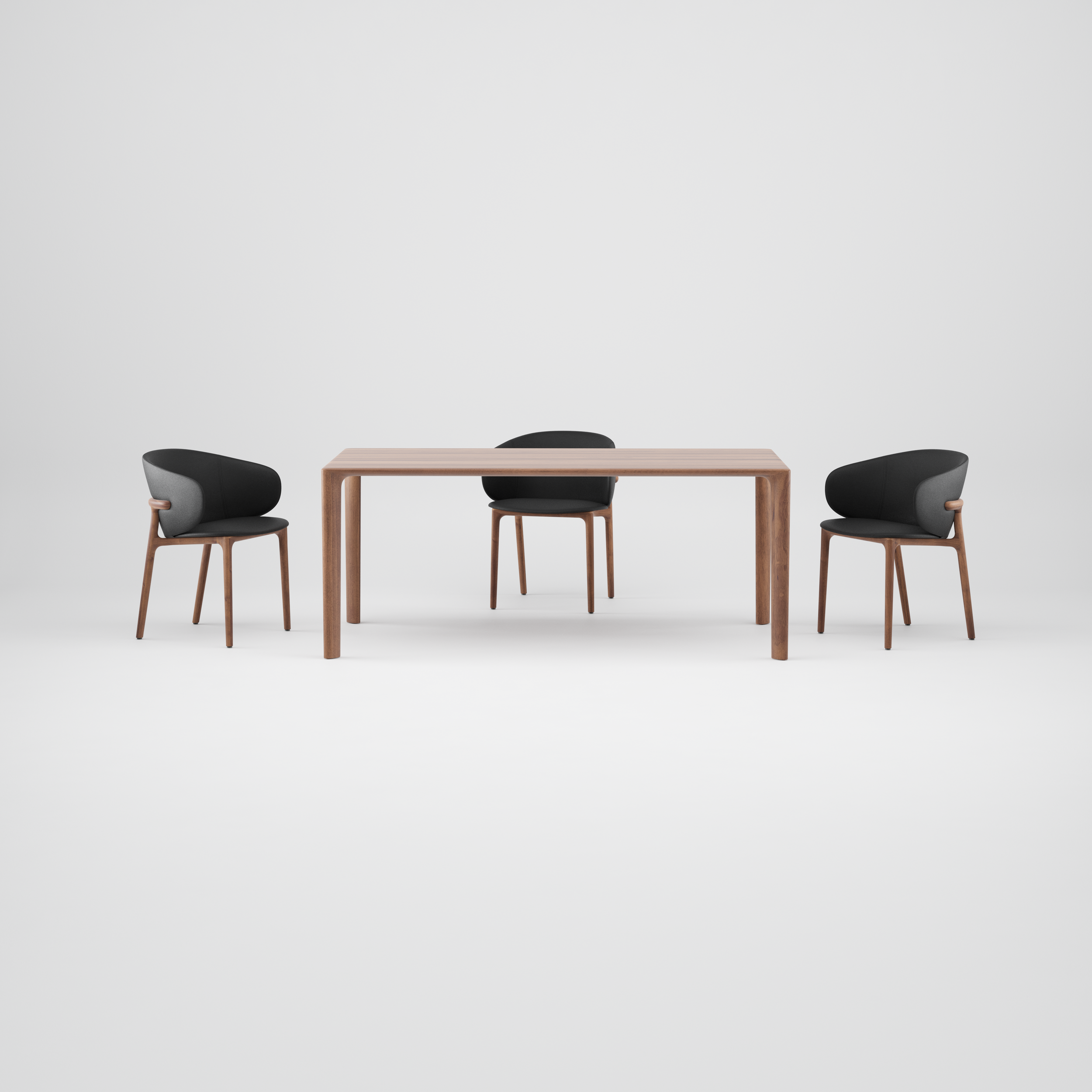 Mela Table with a solid wood top and rounded edges, featuring clean, balanced lines and refined craftsmanship.