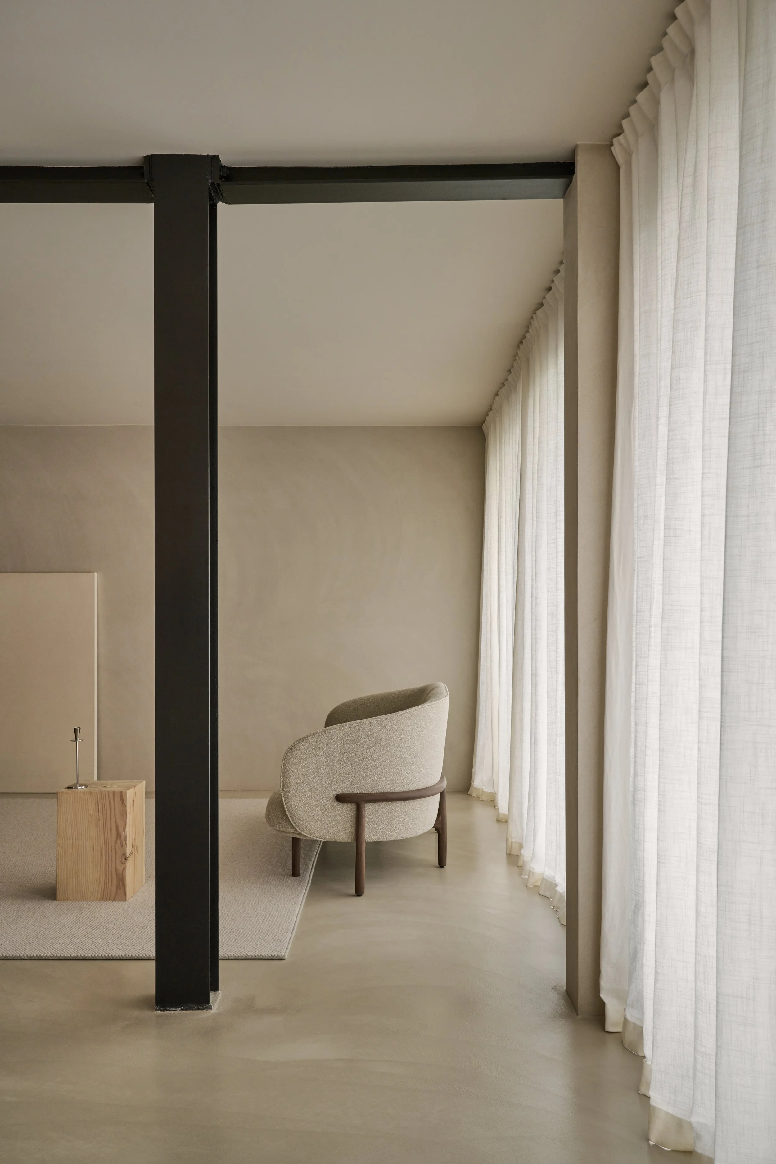 “Mela Lounge Two-Seater placed in a contemporary interior, combining comfort, warmth, and refined craftsmanship.