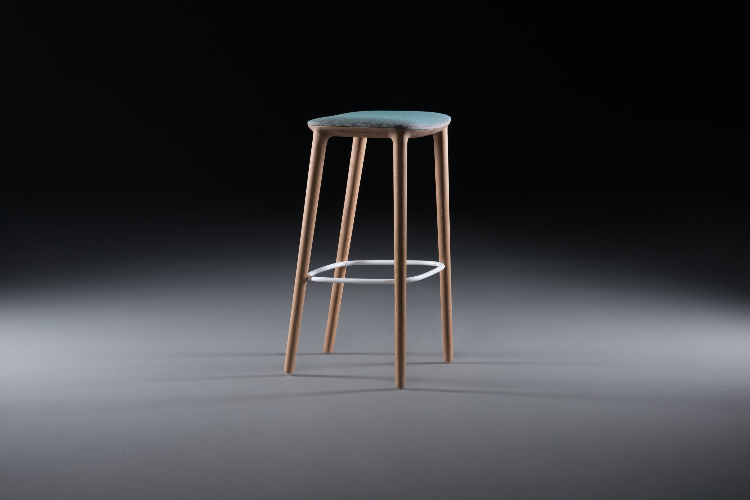 Neva bar chair designed in 2014, extending the Neva collection with a taller seating option..