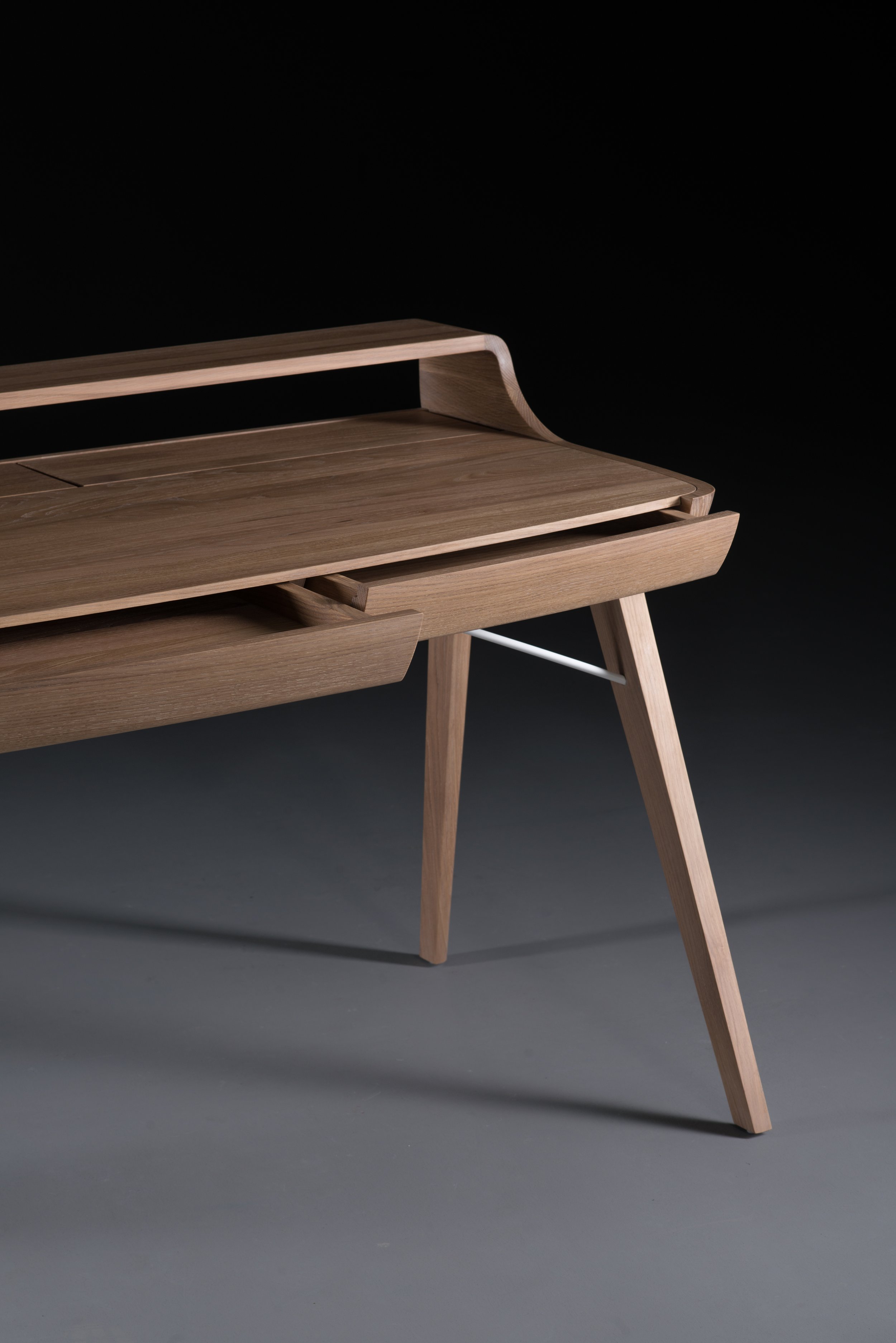 Picard Desk with soft-edged wooden body and elegant lateral legs