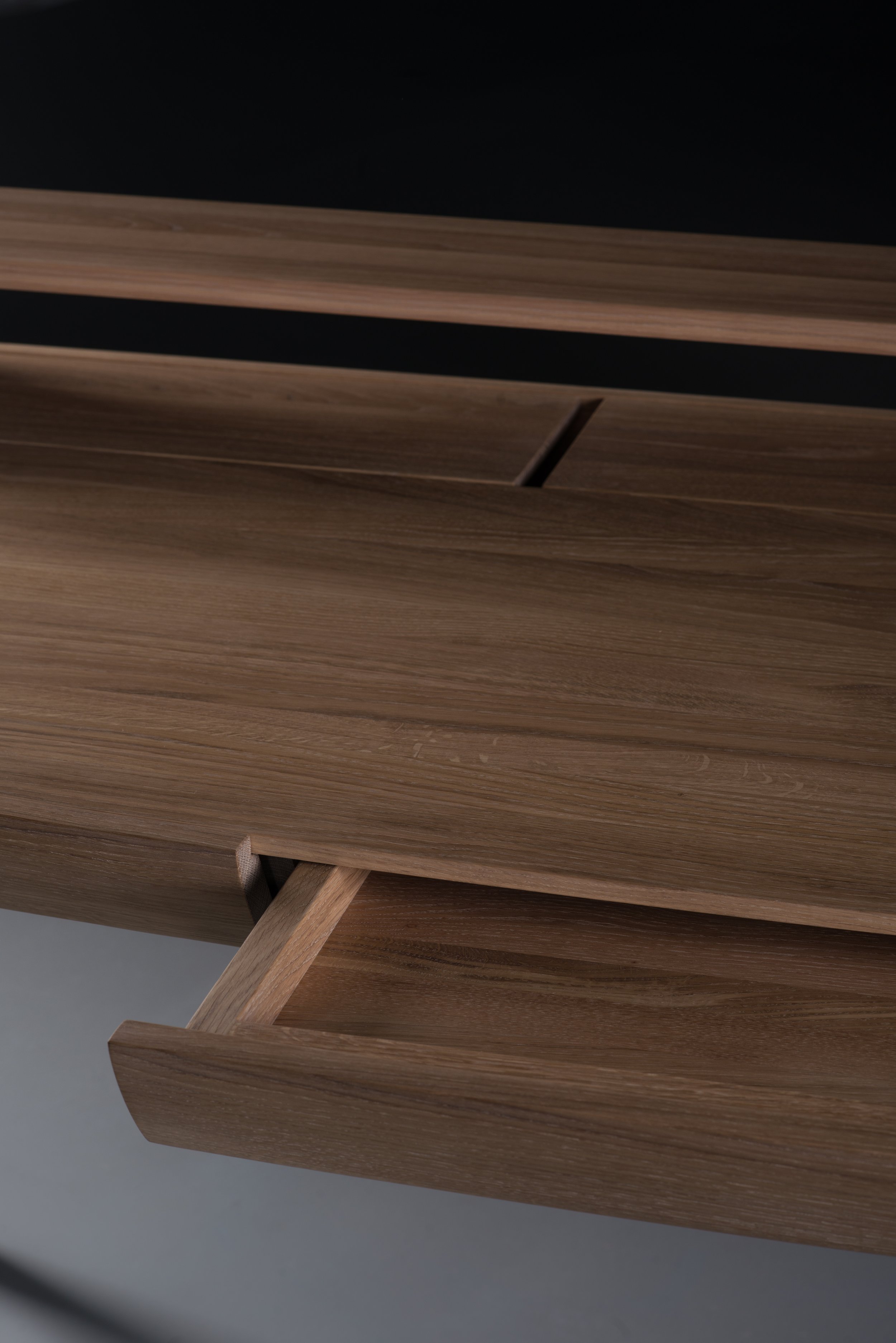 Picard Desk with soft-edged wooden body and elegant lateral legs