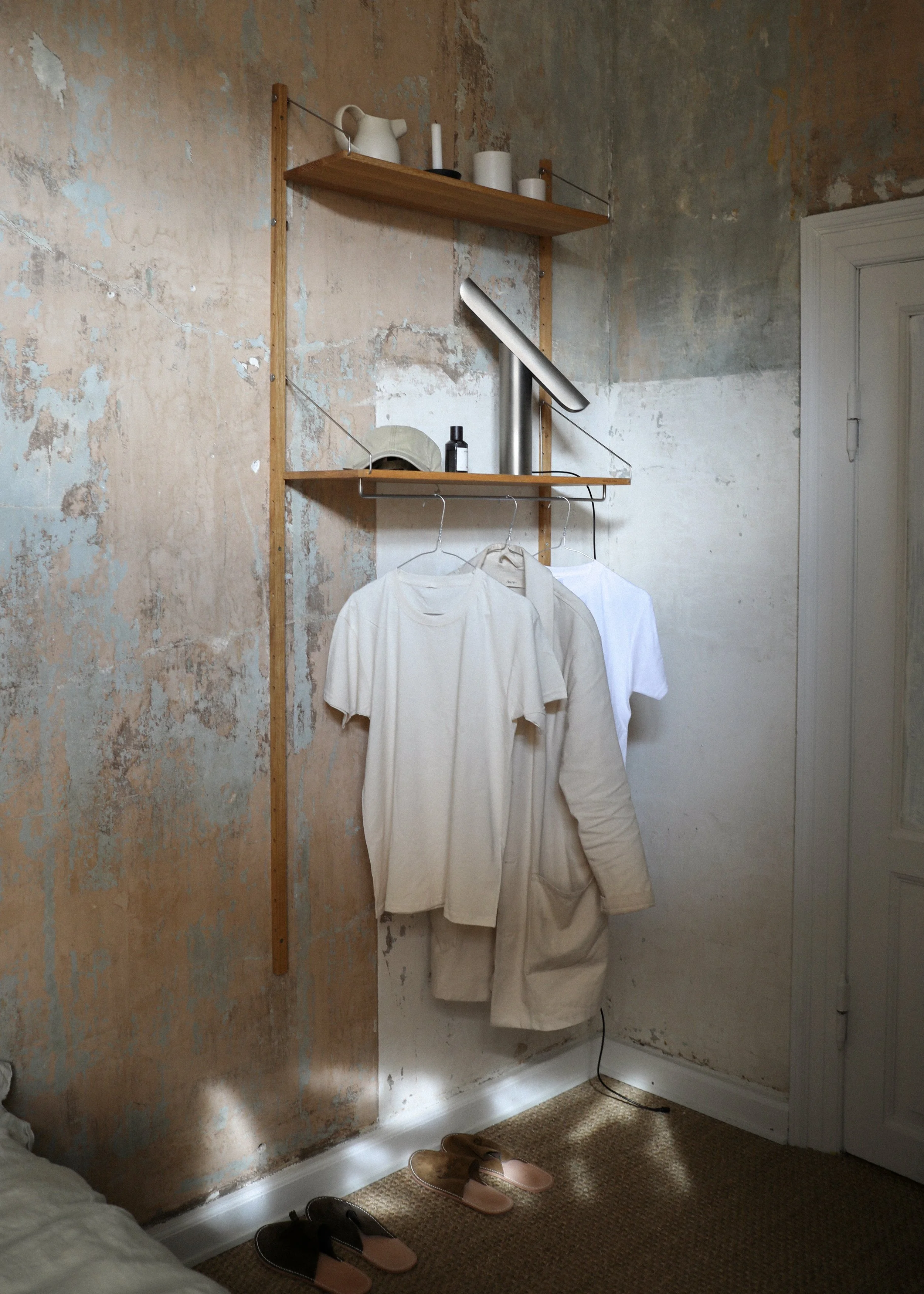 Detail of T Lamp showing its tilting mechanism, allowing adjustable light direction while maintaining a minimalist, geometric design.