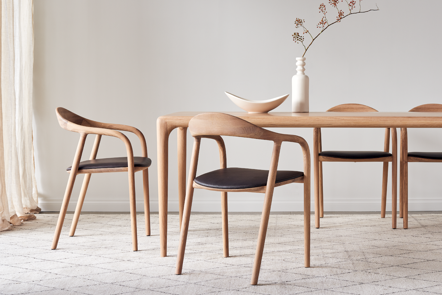 Multiple views of Neva Chair highlighting elegant curves and ergonomic form