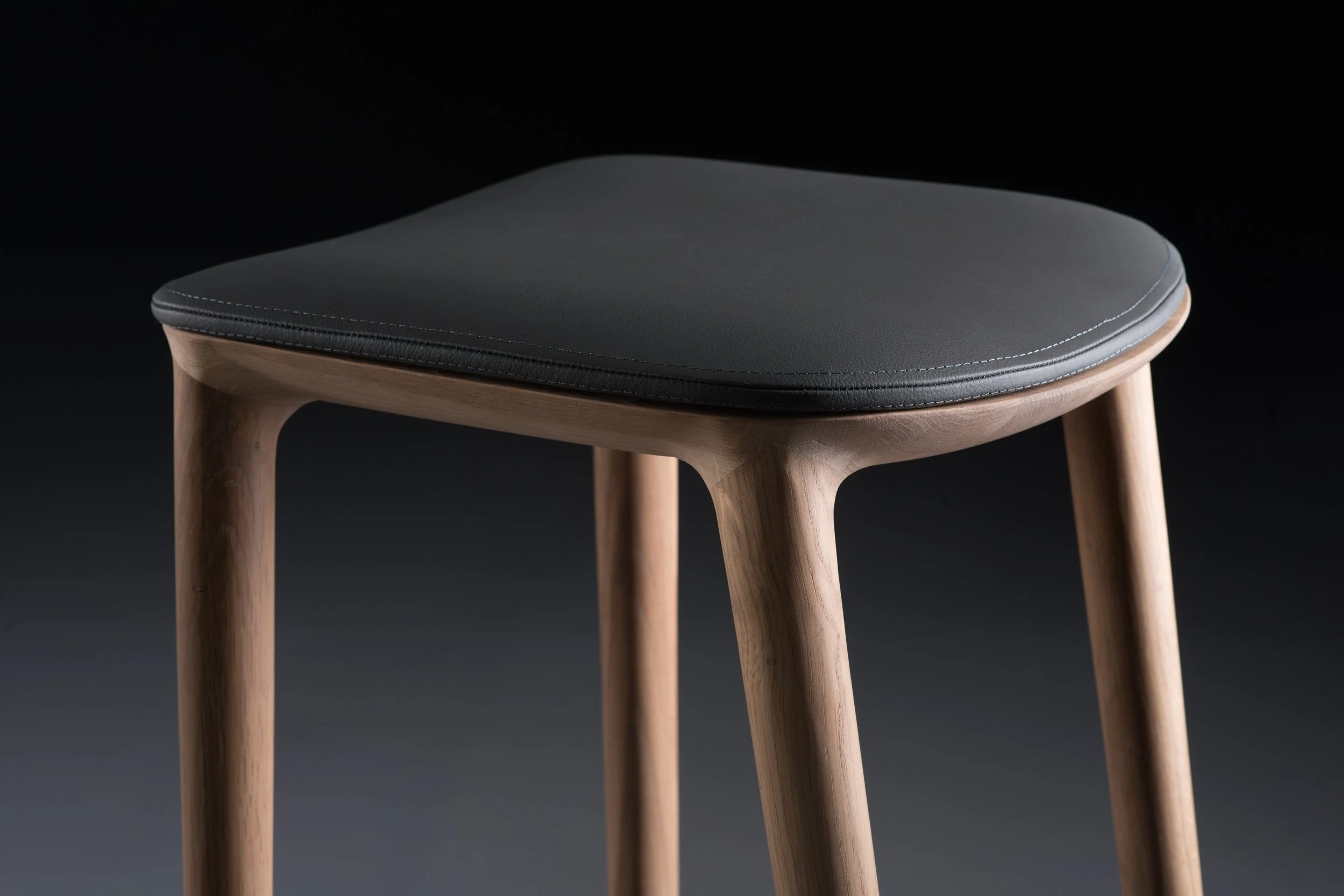 Neva bar chair designed in 2014, extending the Neva collection with a taller seating option.