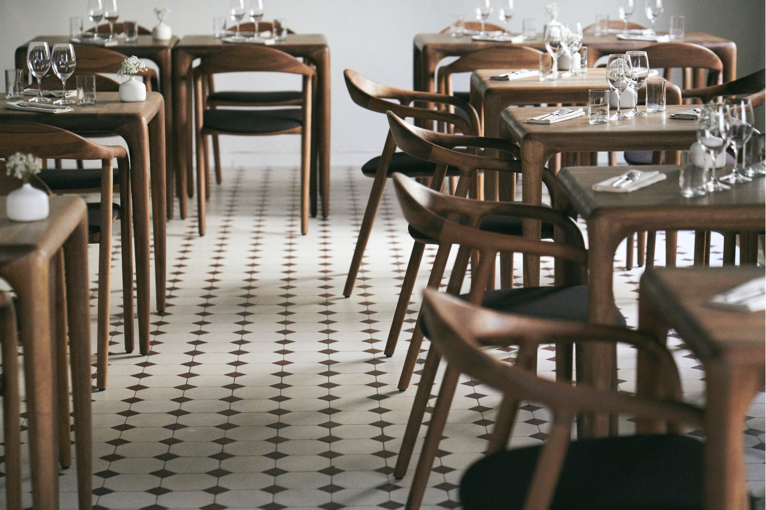 Multiple views of Neva Chair highlighting elegant curves and ergonomic form